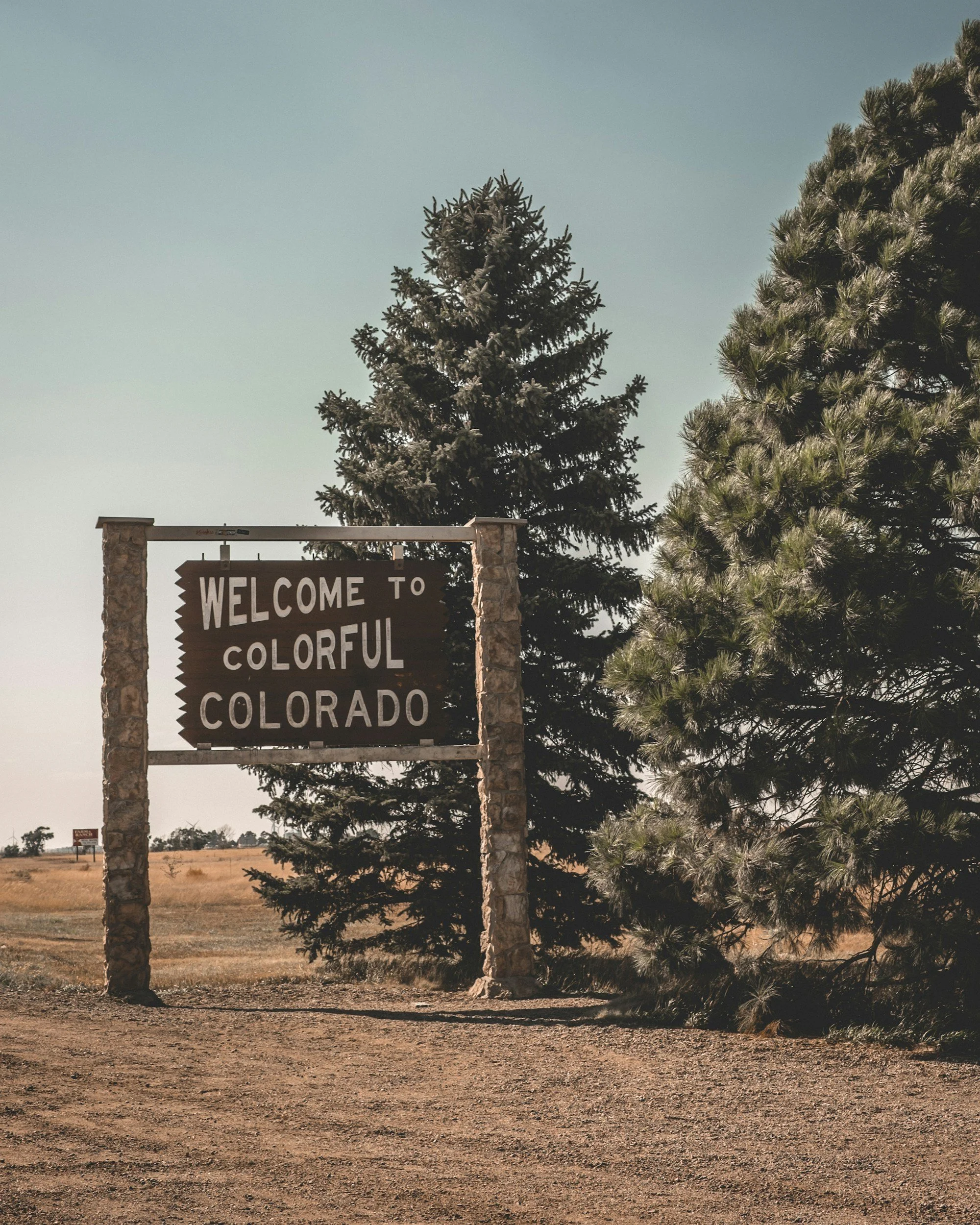 Welcome to Beautiful Colorado sign in front of trees