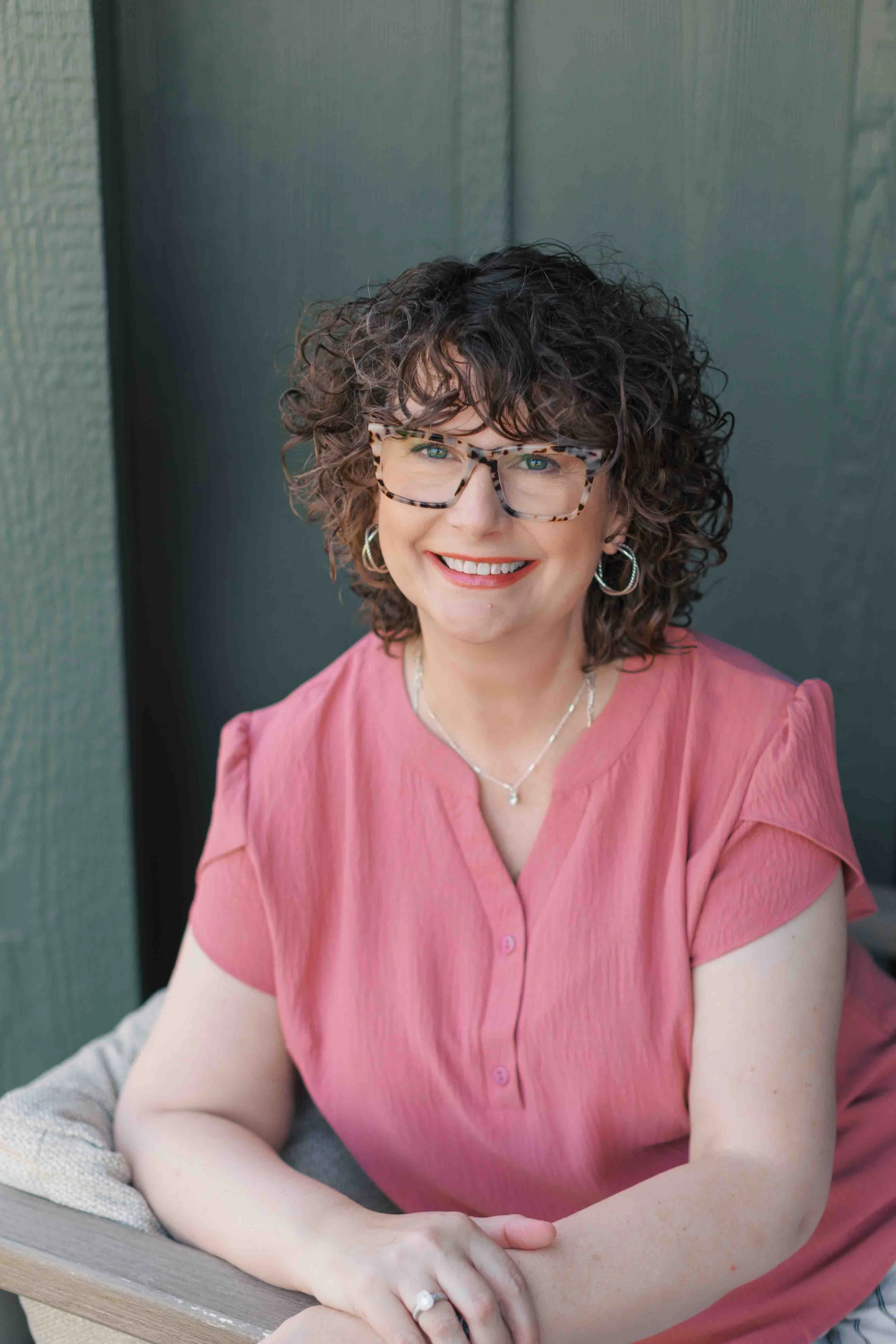 Nichole Alspaugh Williams therapist in Bloomington sits outside and smiles