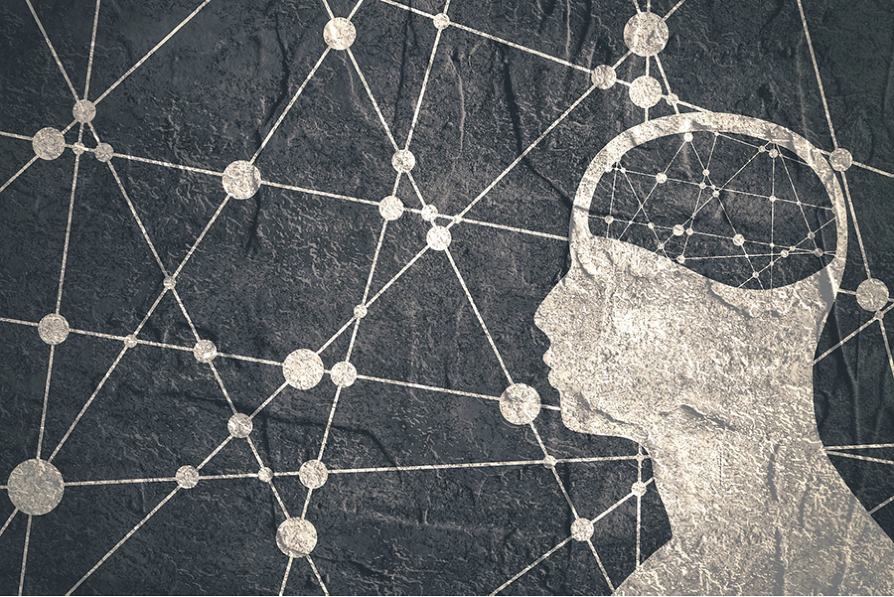 Side view of human figure with brain outlined with lines and dots
