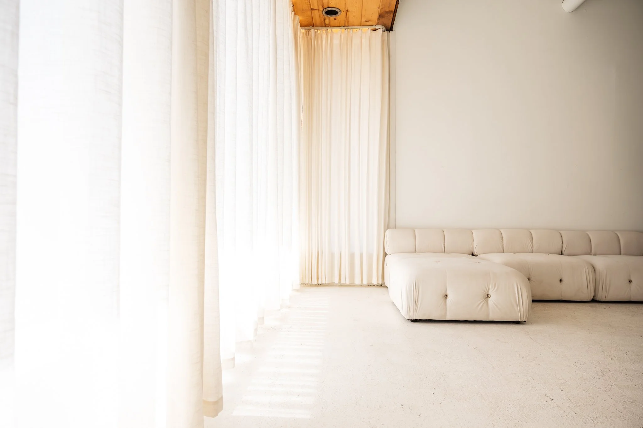 Front studio space with a living room set up. Perfect for daylight photography.