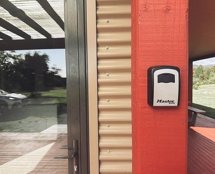 Close view of the Mountain View Retreat lockbox on the red post