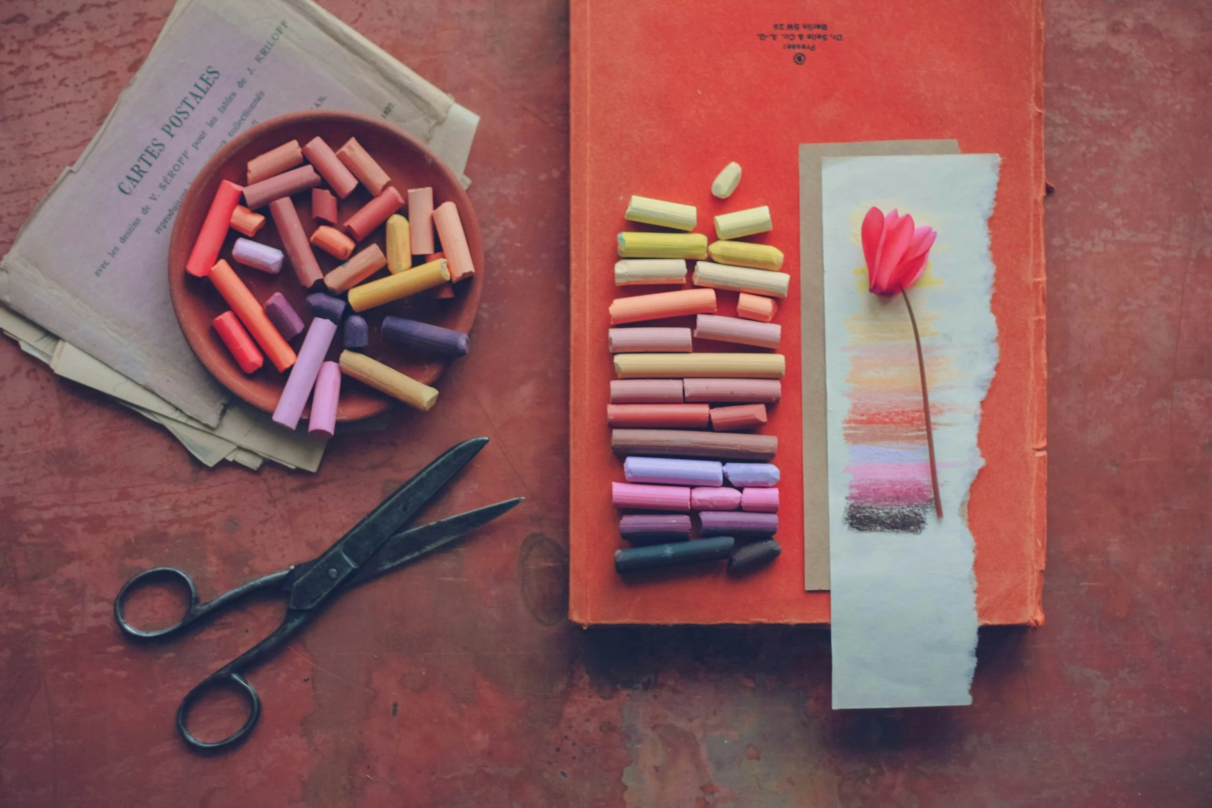 Softly arranged art materials representing accessible creative rituals for overwhelmed moms.
