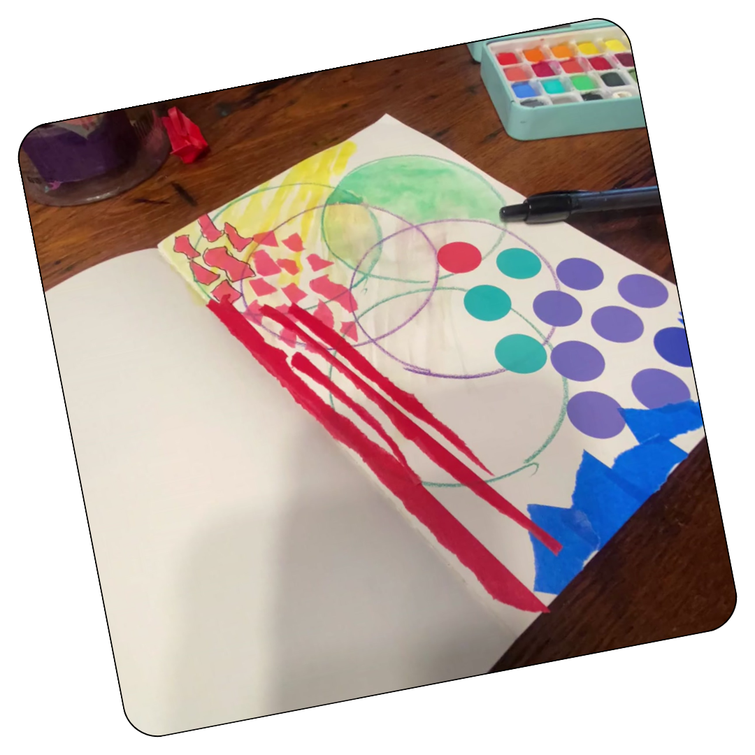 Hand drawing loose scribbles in a journal as a grounding creative practice for overwhelmed moms.