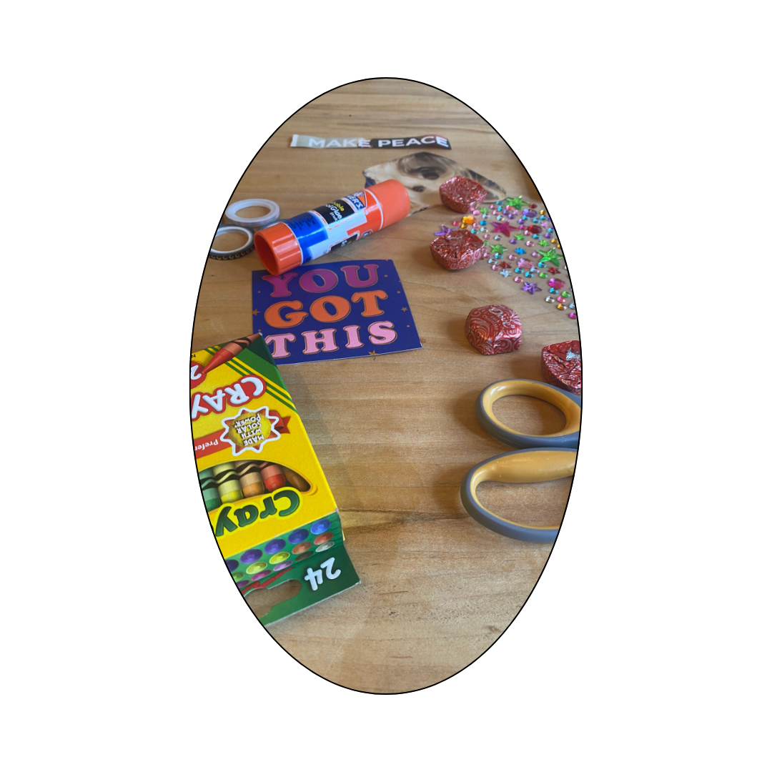 Messy art supplies symbolizing the emotional and mental load of motherhood.