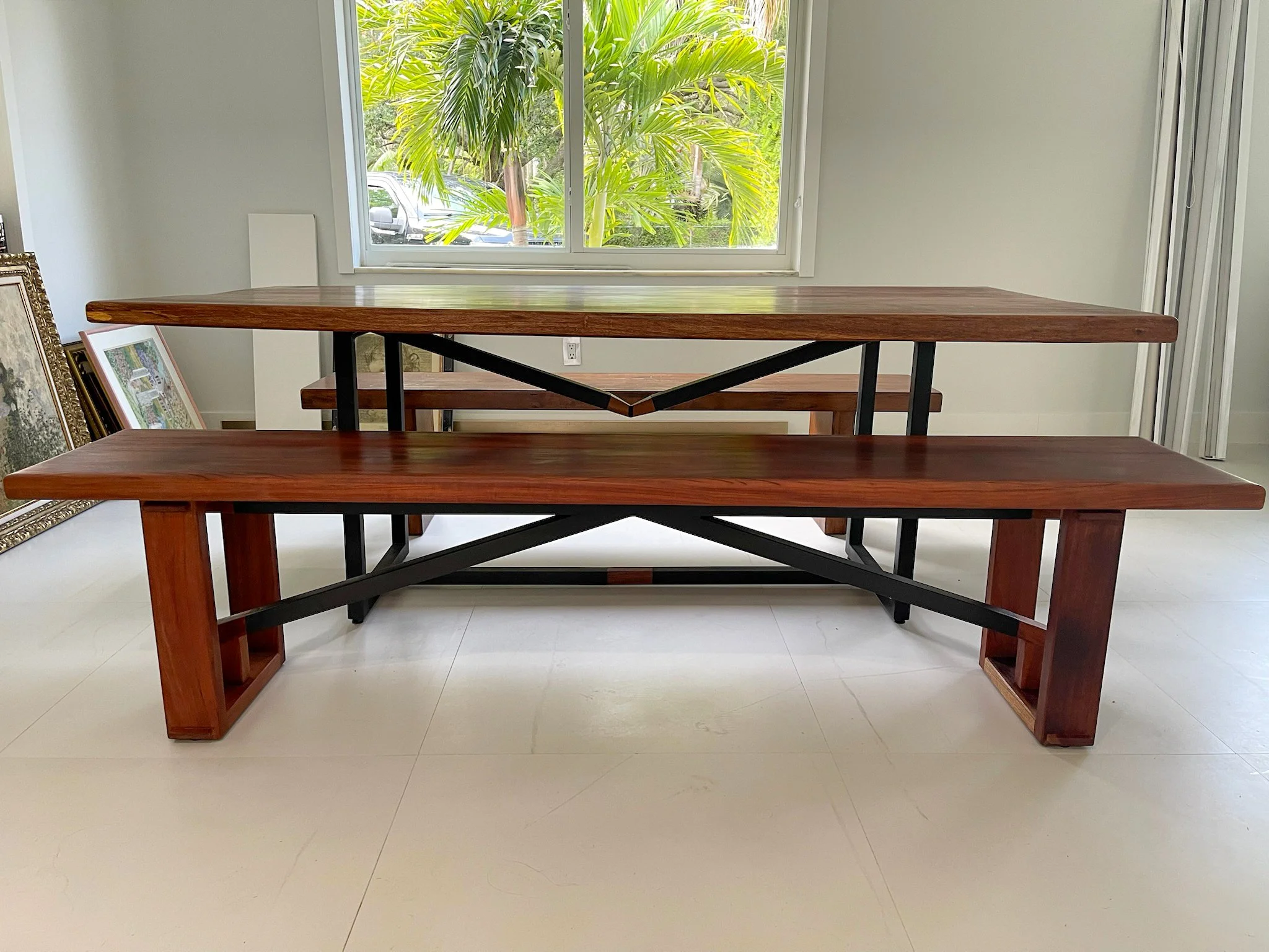Mahogany table and bench with metal and wood supporting bases. 
