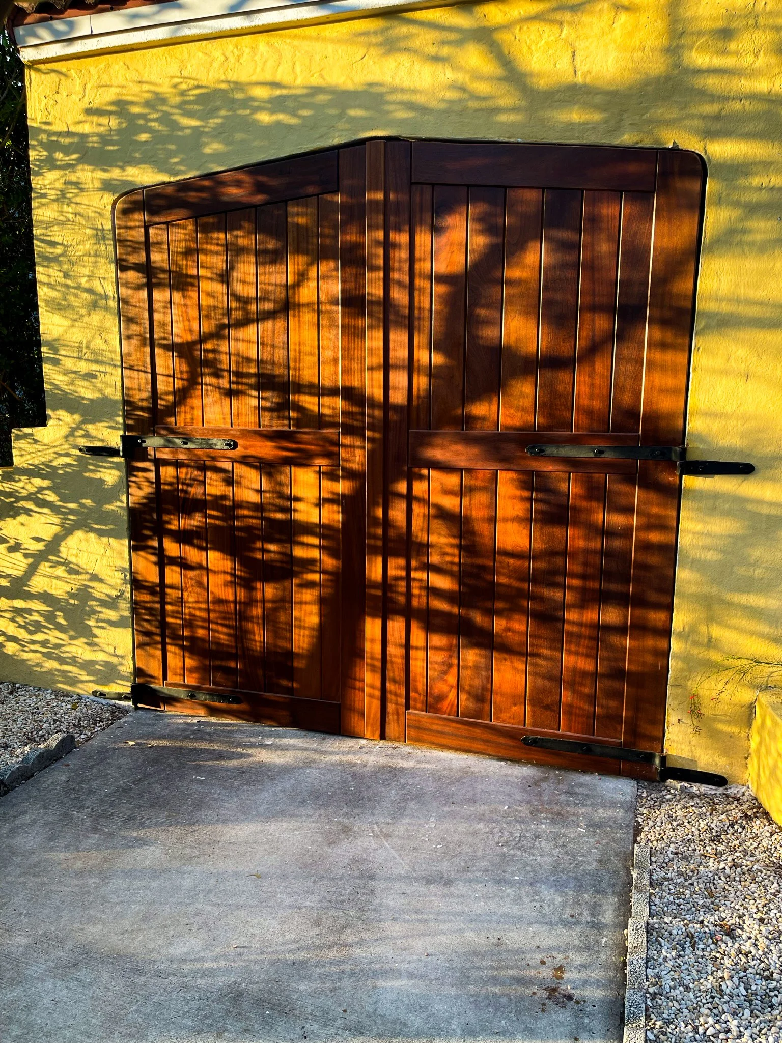 Sapele Carriage doors with custom forged hinges. 