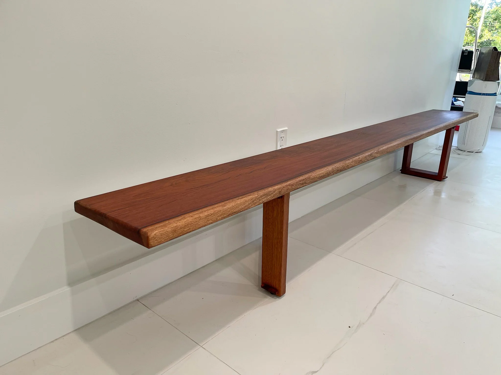 Mahogany bench with asymmetrical mortis and tennon base.