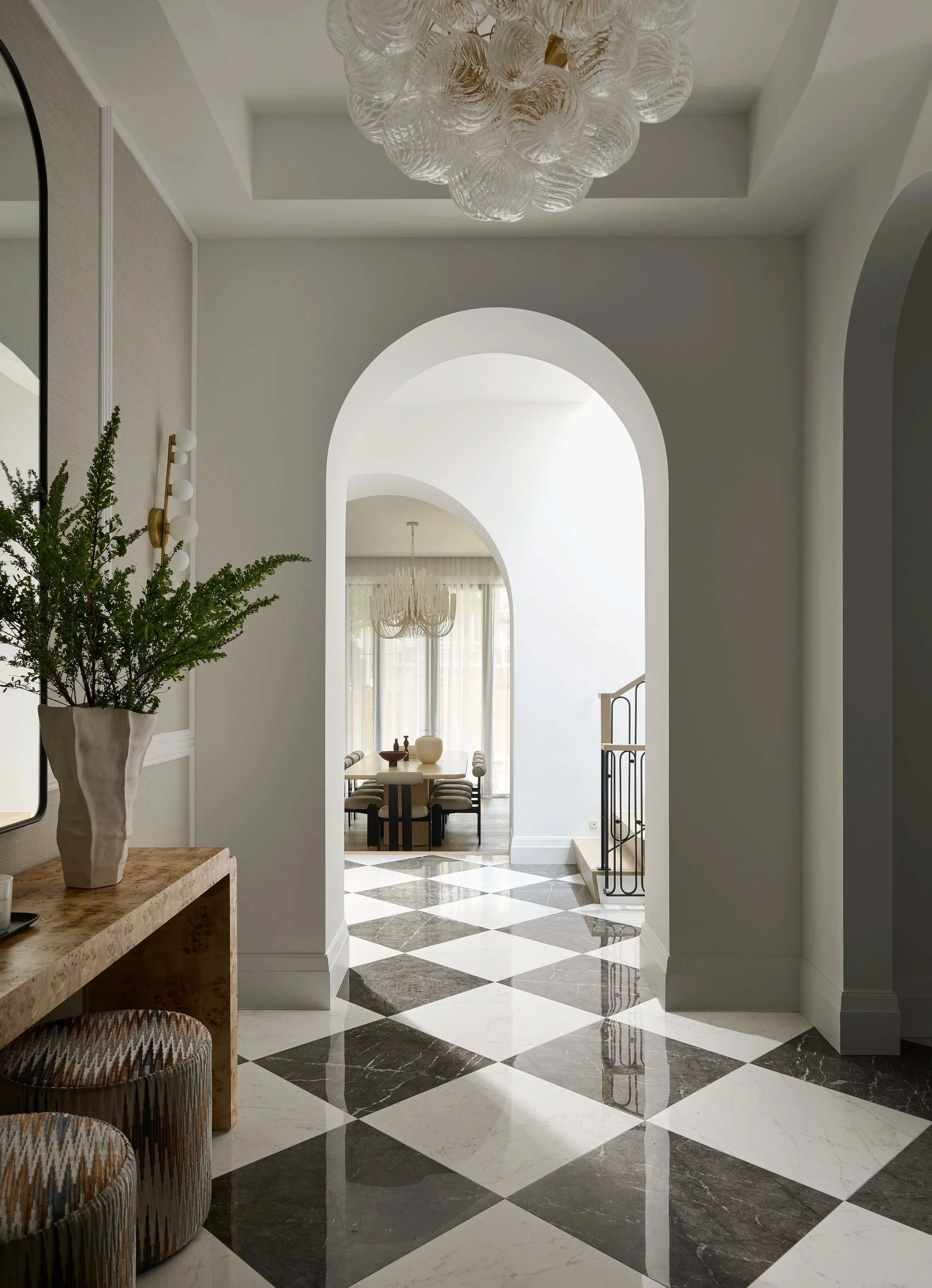 entry hall + checkerboard marble floor + arched millwork + armour heights north york