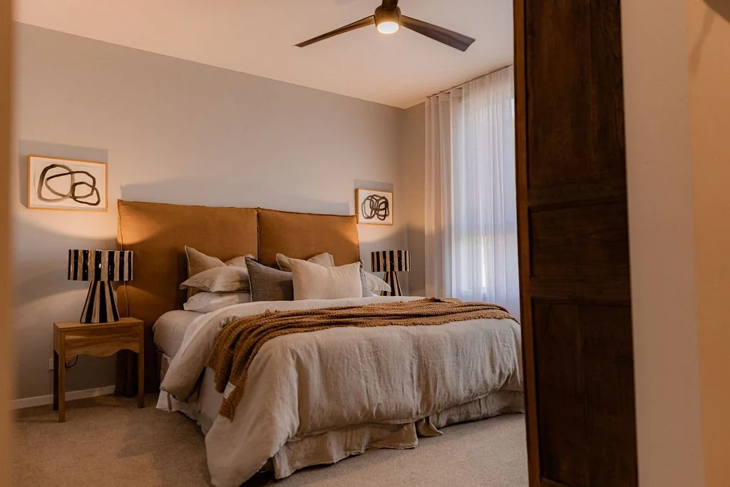 Bedroom featuring sea view windows and minimalist design at Cooinda on the Beach, Bicheno.