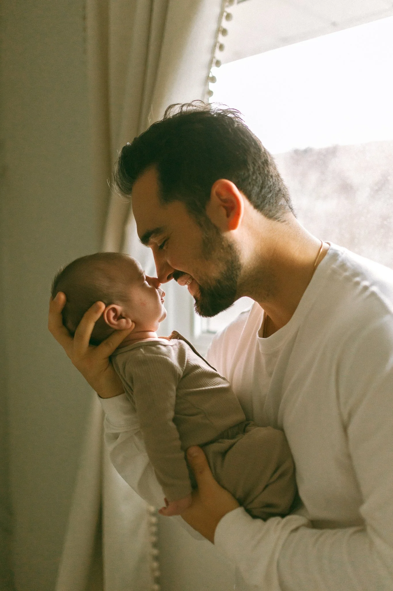 Father Nose to Nose with Newborn
