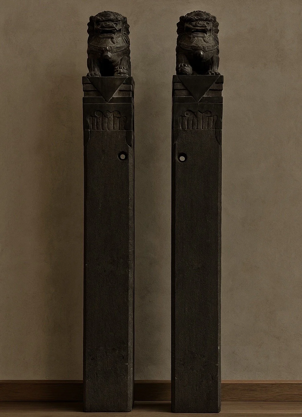 Antique hand carved stone guardian columns curated by Wild Form Design Studio NYC featuring sculptural architectural decor and historic stone craftsmanship