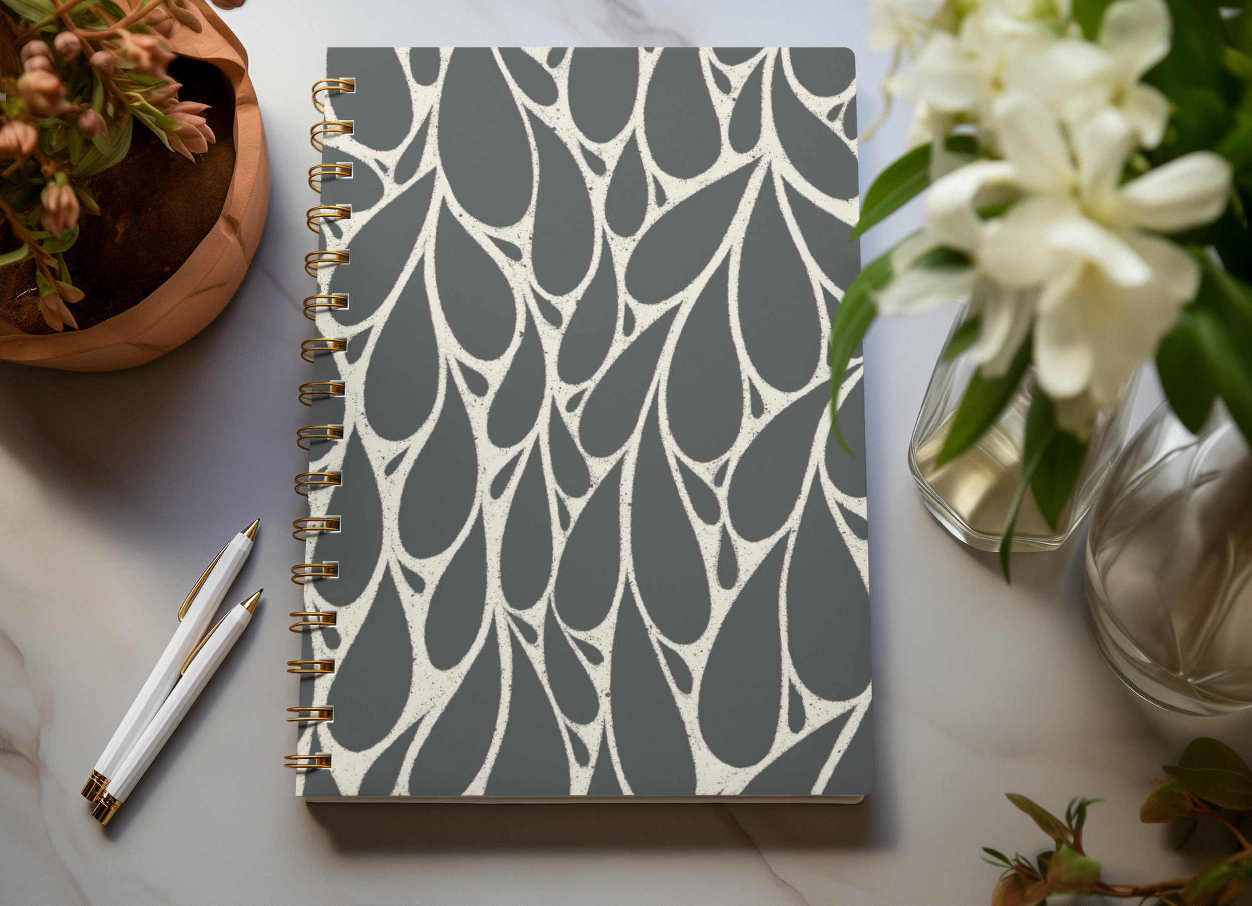 mockup-of-a-spiral-notebook-placed-over-an-ai-generated-marble-table-m38119.png