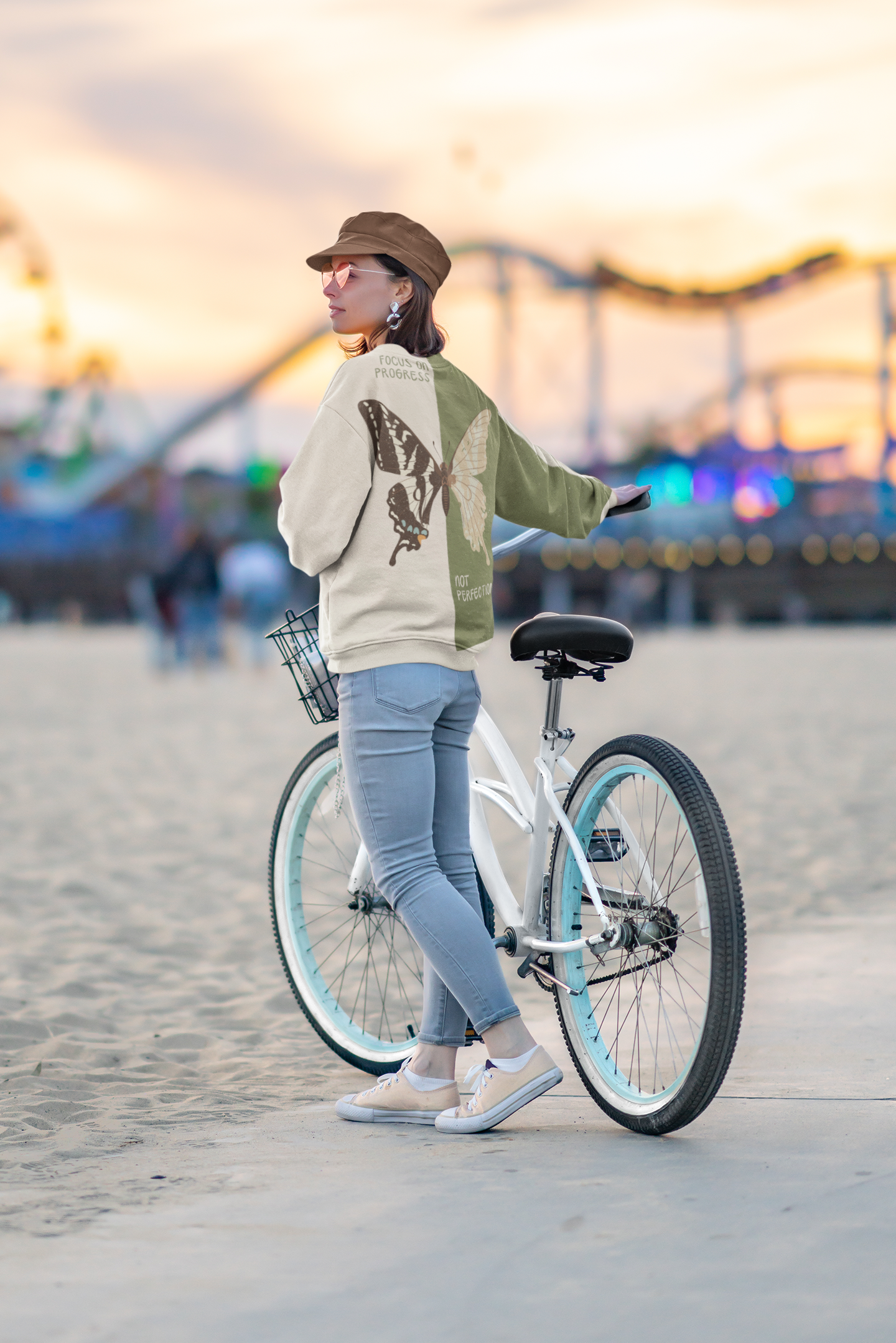 mockup-of-a-young-woman-with-a-sublimated-sweatshirt-at-an-amusement-park-39843-r-el2 (1).png