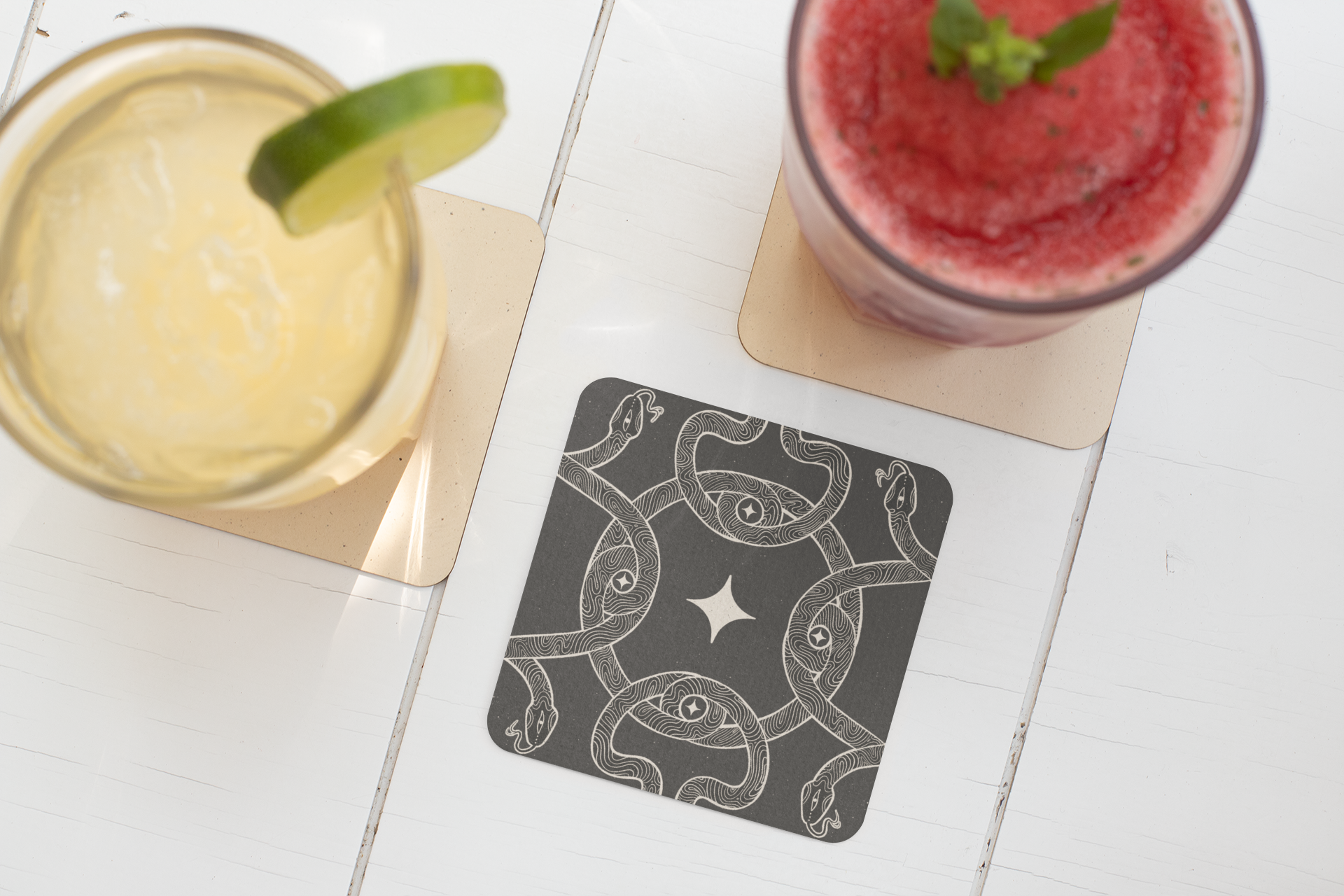 square-coaster-mockup-featuring-two-drinks-on-a-white-wooden-table-27799.png