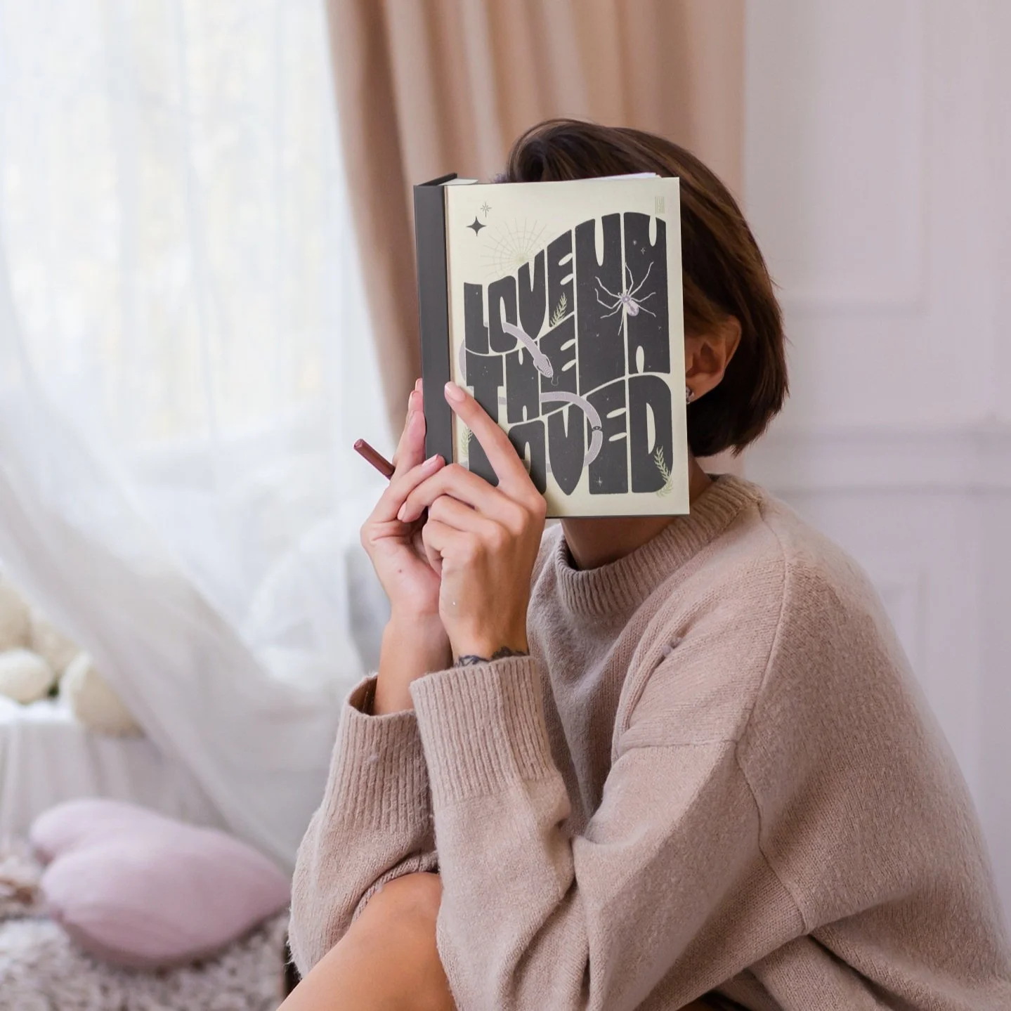 mockup-of-a-tattooed-woman-covering-her-face-with-a-book-m6748-r-el2 (1).jpg