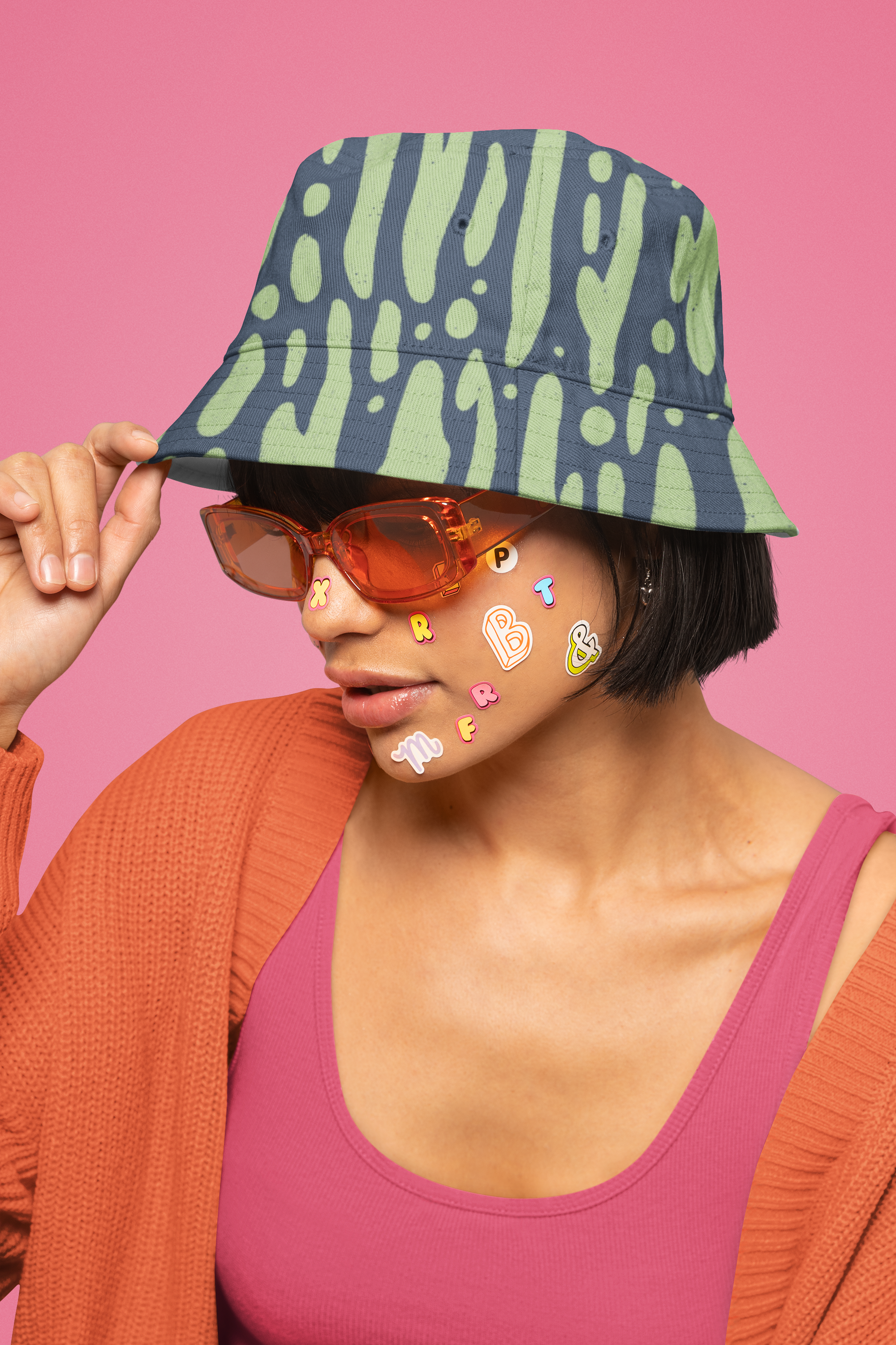 bucket-hat-mockup-featuring-a-woman-with-stickers-on-her-face-m32376.png