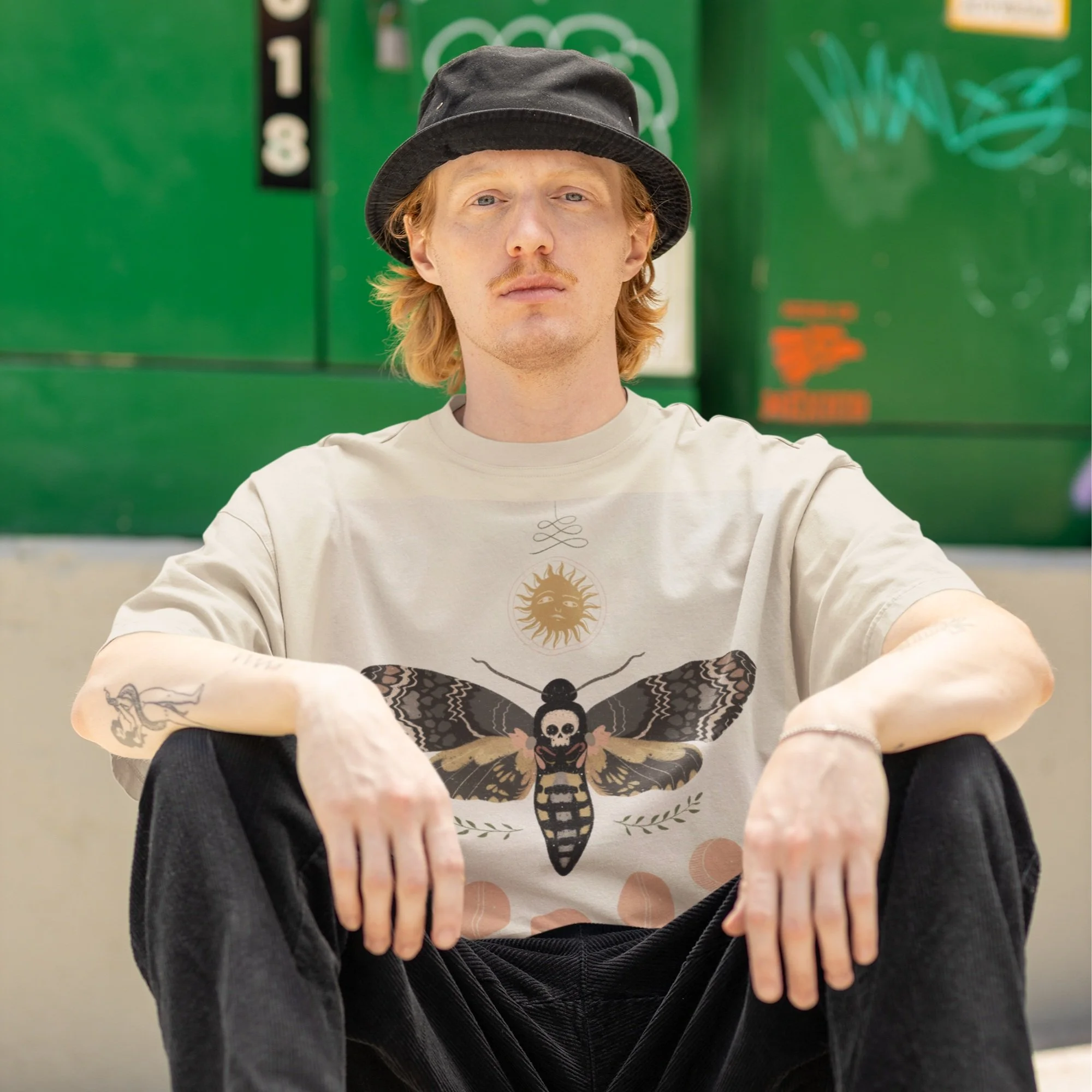 hip-hop-inspired-mockup-of-a-man-with-an-arm-tattoo-wearing-an-oversized-tee-m39247 copy.jpg