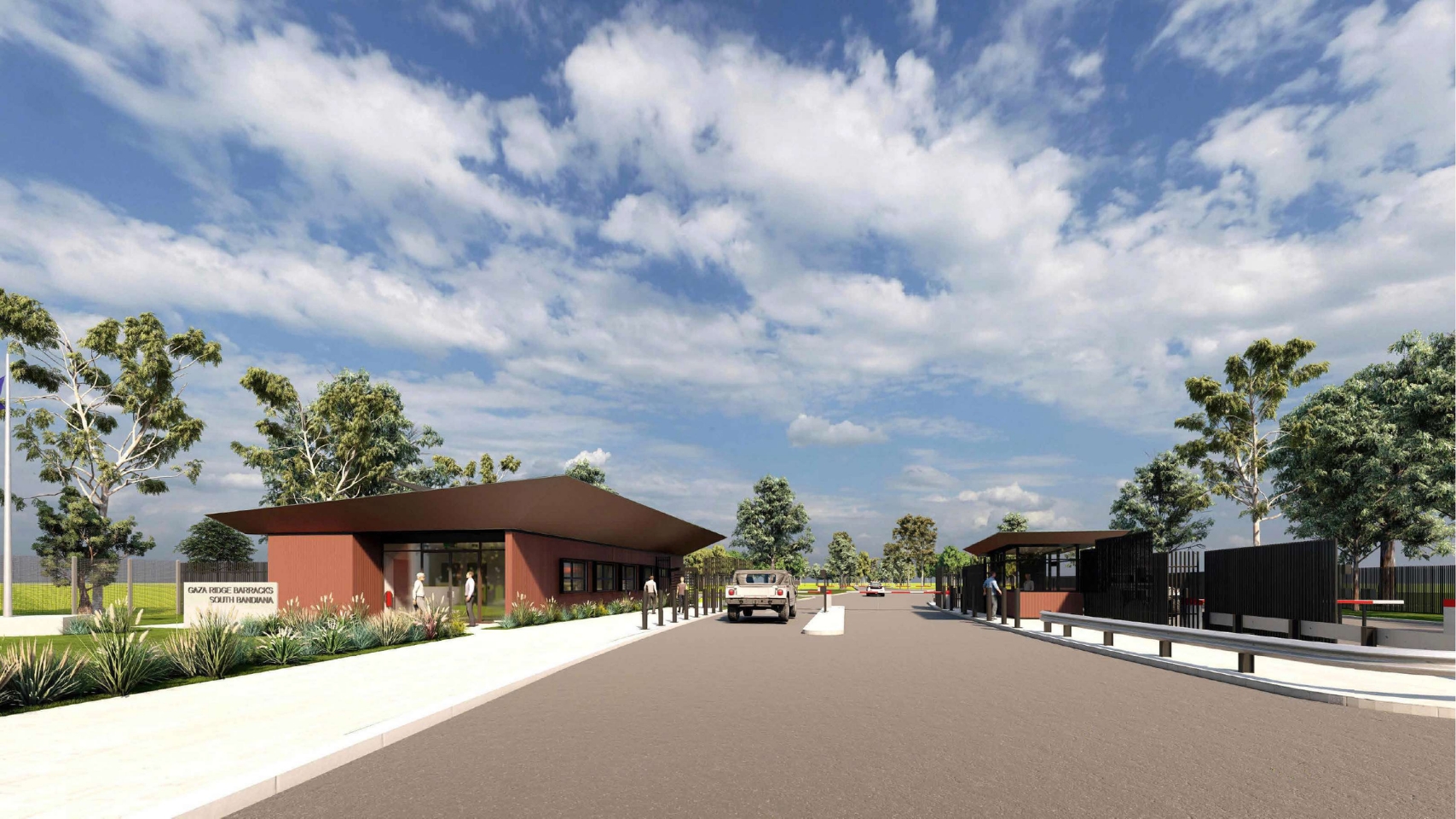 Entrance gate with security booths, guard posts, driveway, and a white truck, surrounded by greenery and trees under a partly cloudy sky.