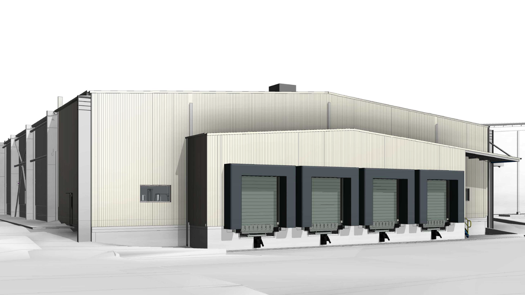 A large industrial building with five loading docks, beige metal siding, and an industrial design.