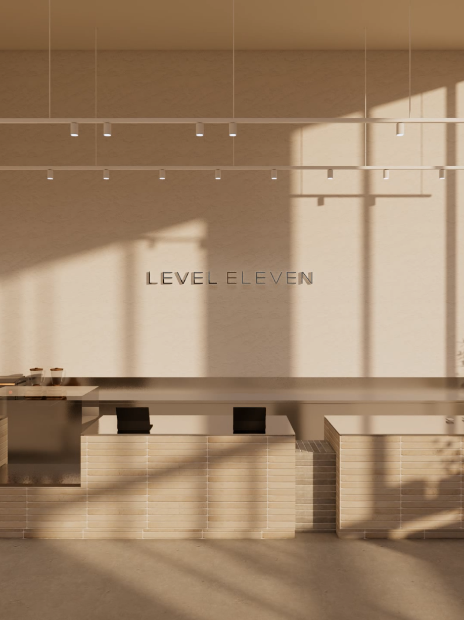 Level Eleven Tonsley reception in Adelaide featuring a refined neutral palette, natural light and contemporary wellness design.