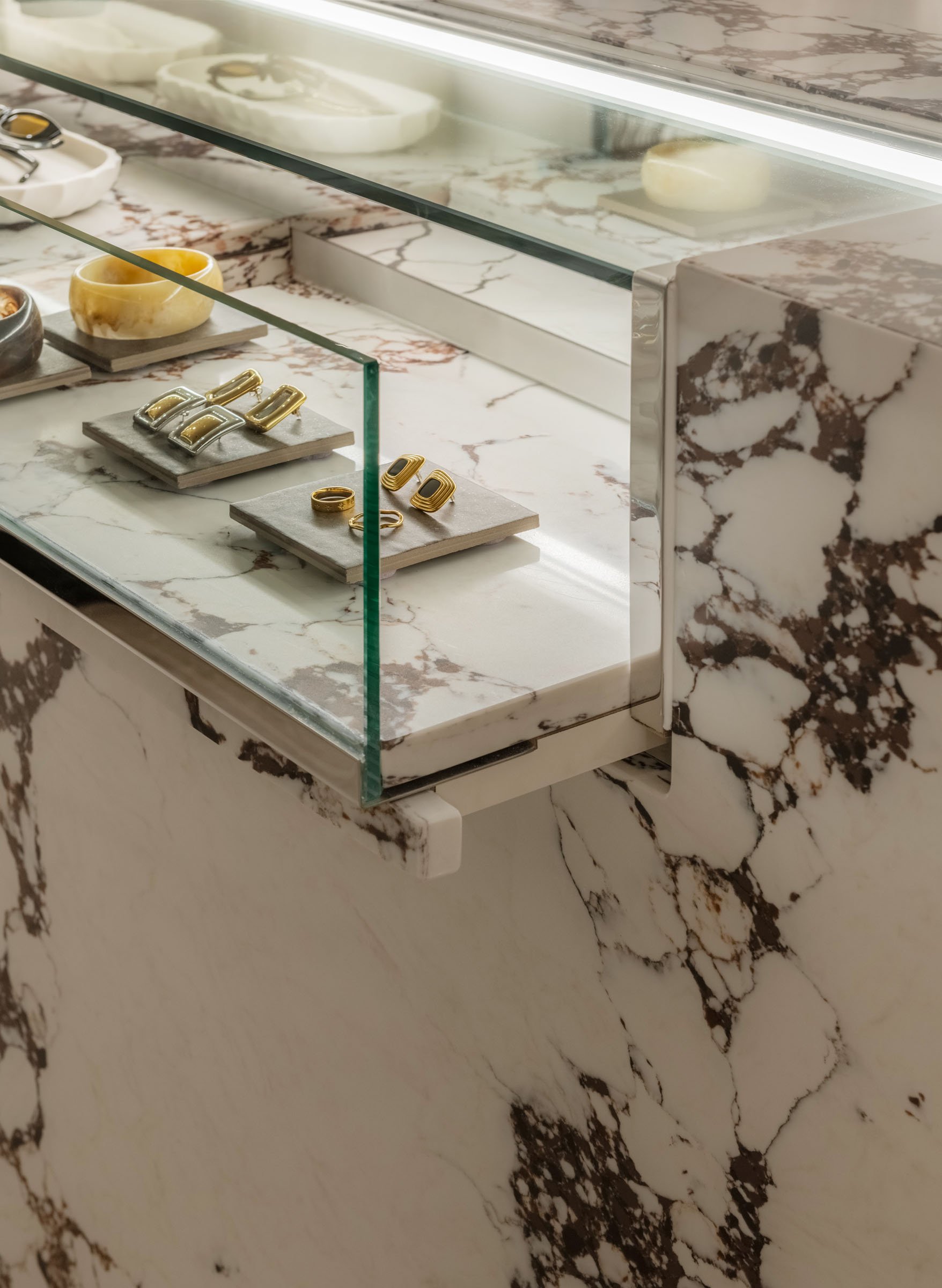 Custom stone retail counter and jewellery display at Sabo Sunshine Plaza, showcasing premium materiality and bespoke boutique detailing.