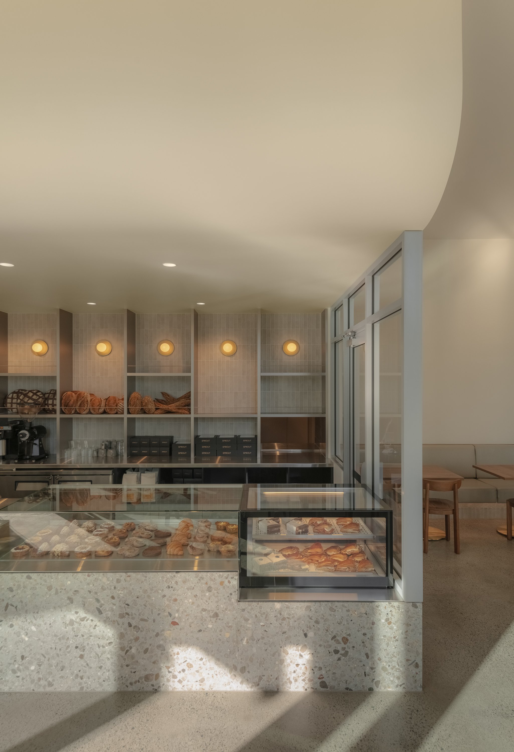 Bakery product display designed by Collectivus, balancing functionality with refined retail presentation in a Brisbane bakery fitout. 
