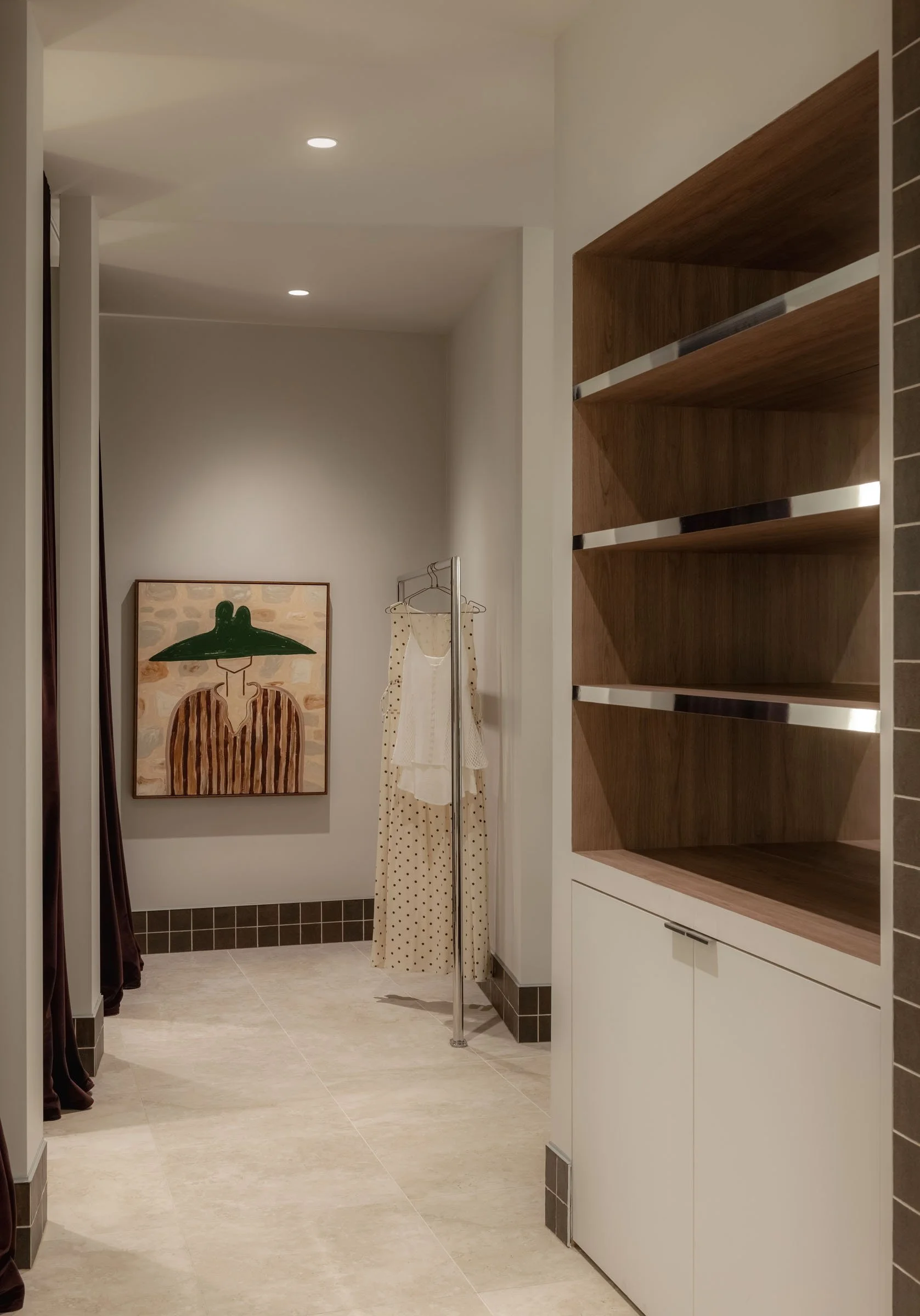 Fashion retail display at Sabo Sunshine Plaza featuring custom timber shelving and refined minimalist interior detailing.