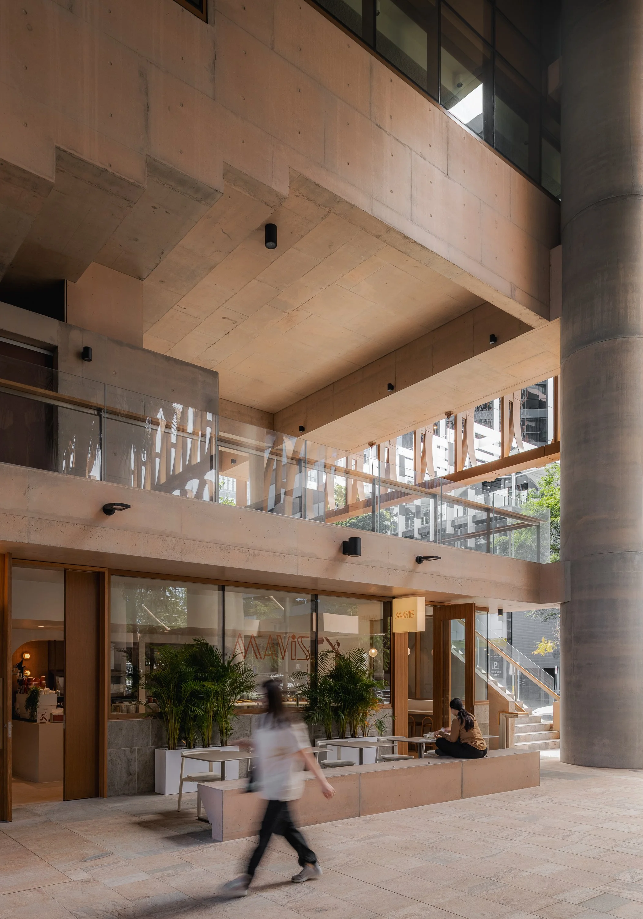 Ground-floor hospitality tenancy within the concrete architectural setting of 205 North Quay.