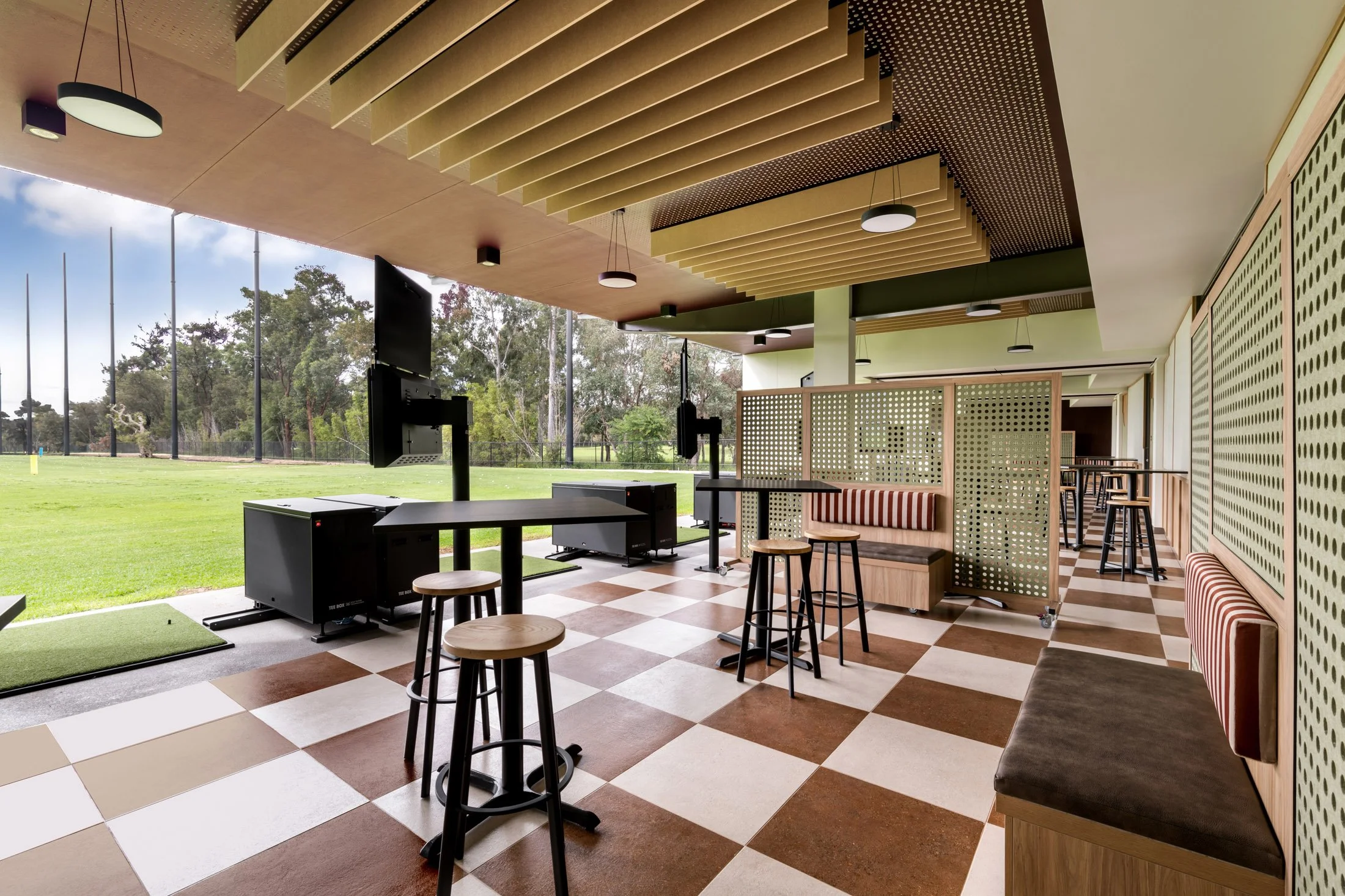 Outdoor golf entertainment bays and social seating at Whaleback Golf Course Perth