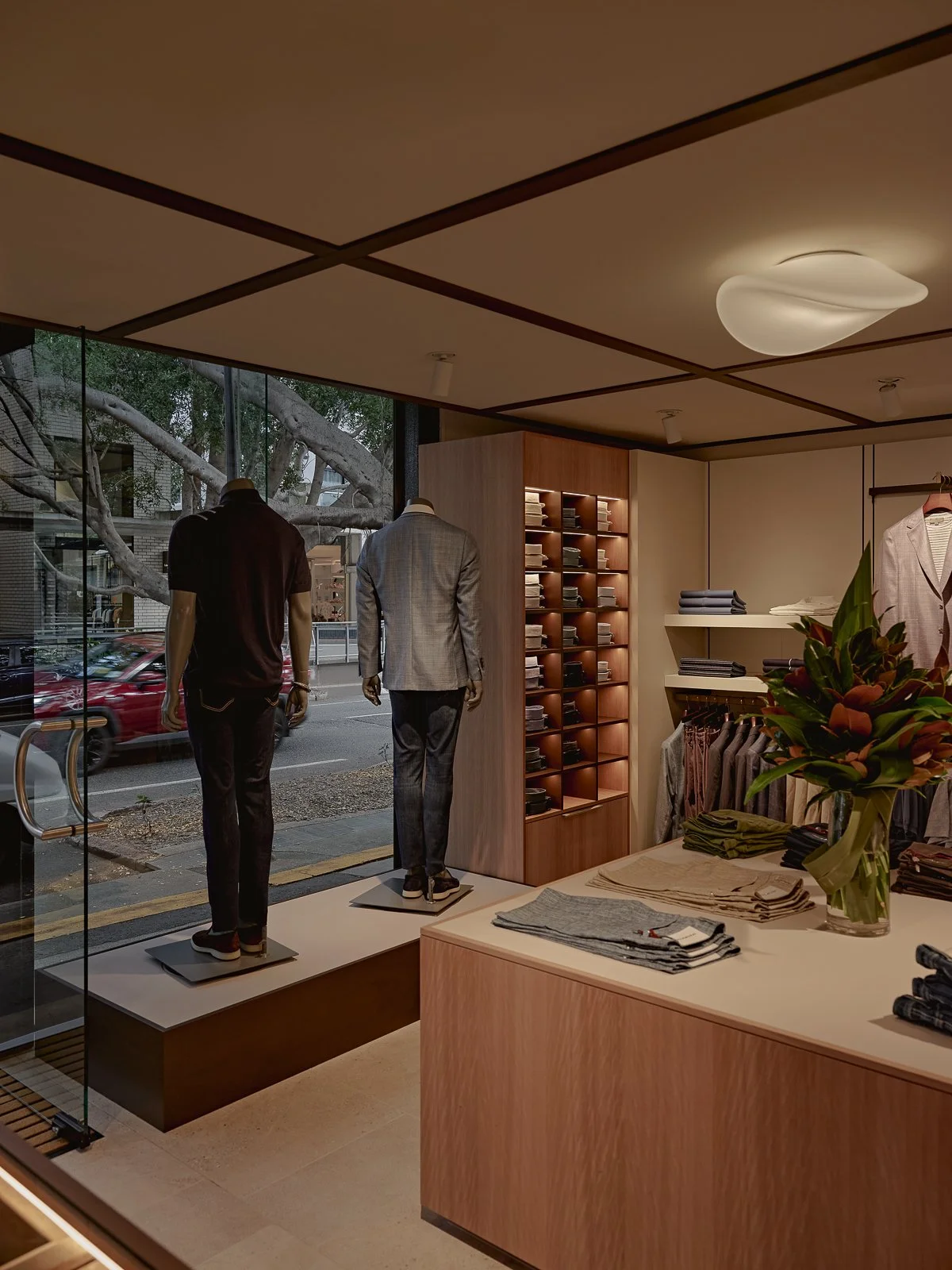 Luxury menswear boutique interior with velvet and timber detailing Brisbane