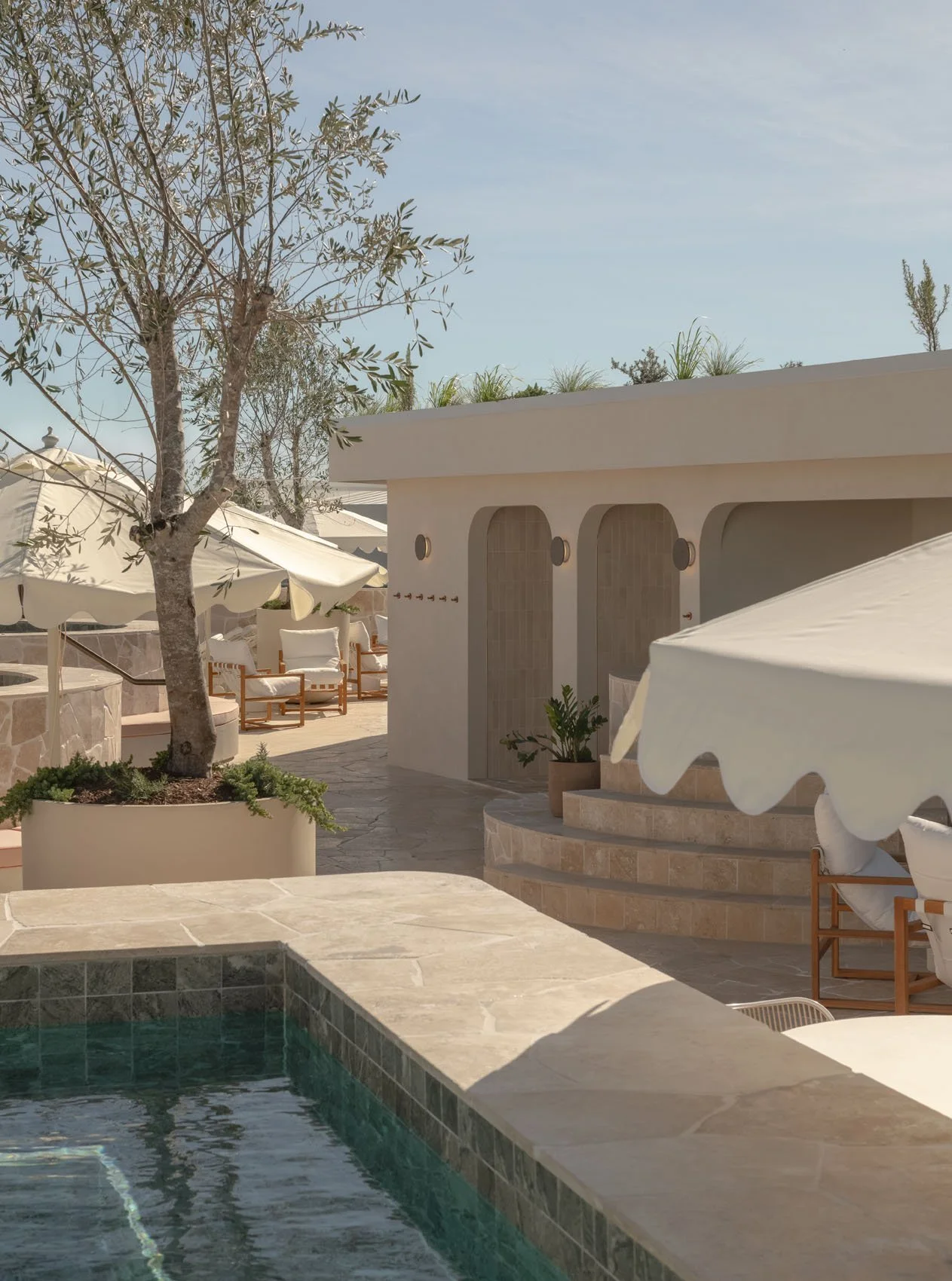 Luxury rooftop wellness zone with hot and cold plunge pools, sauna and steam.