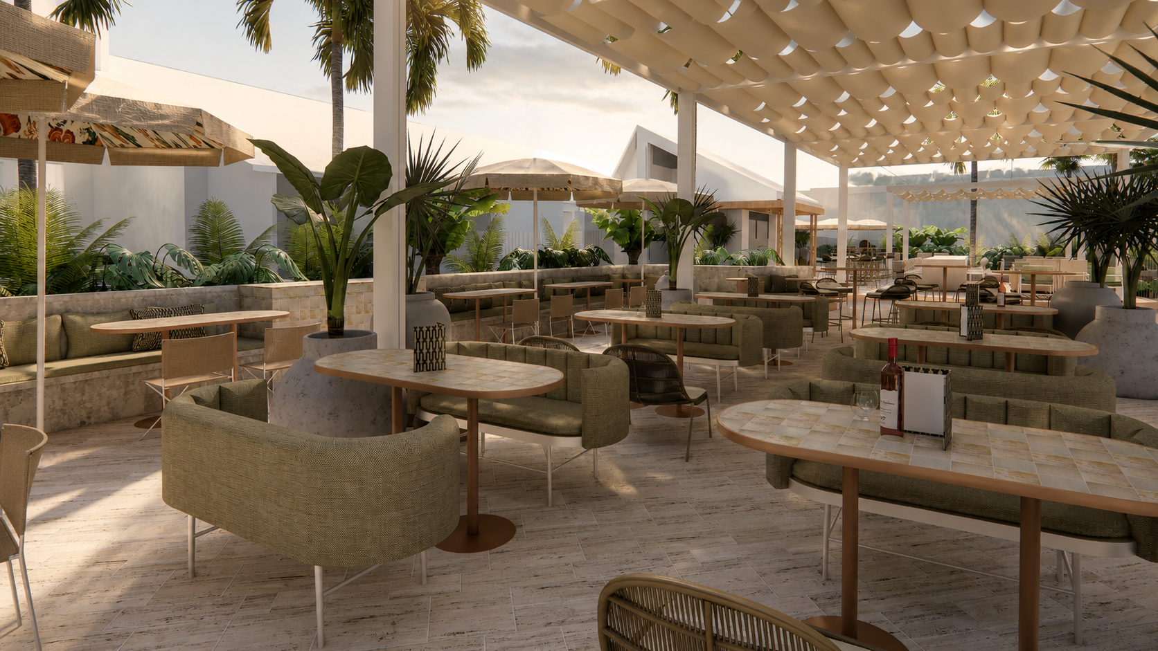 Outdoor hospitality and dining area surrounded by tropical landscaping at The Leea