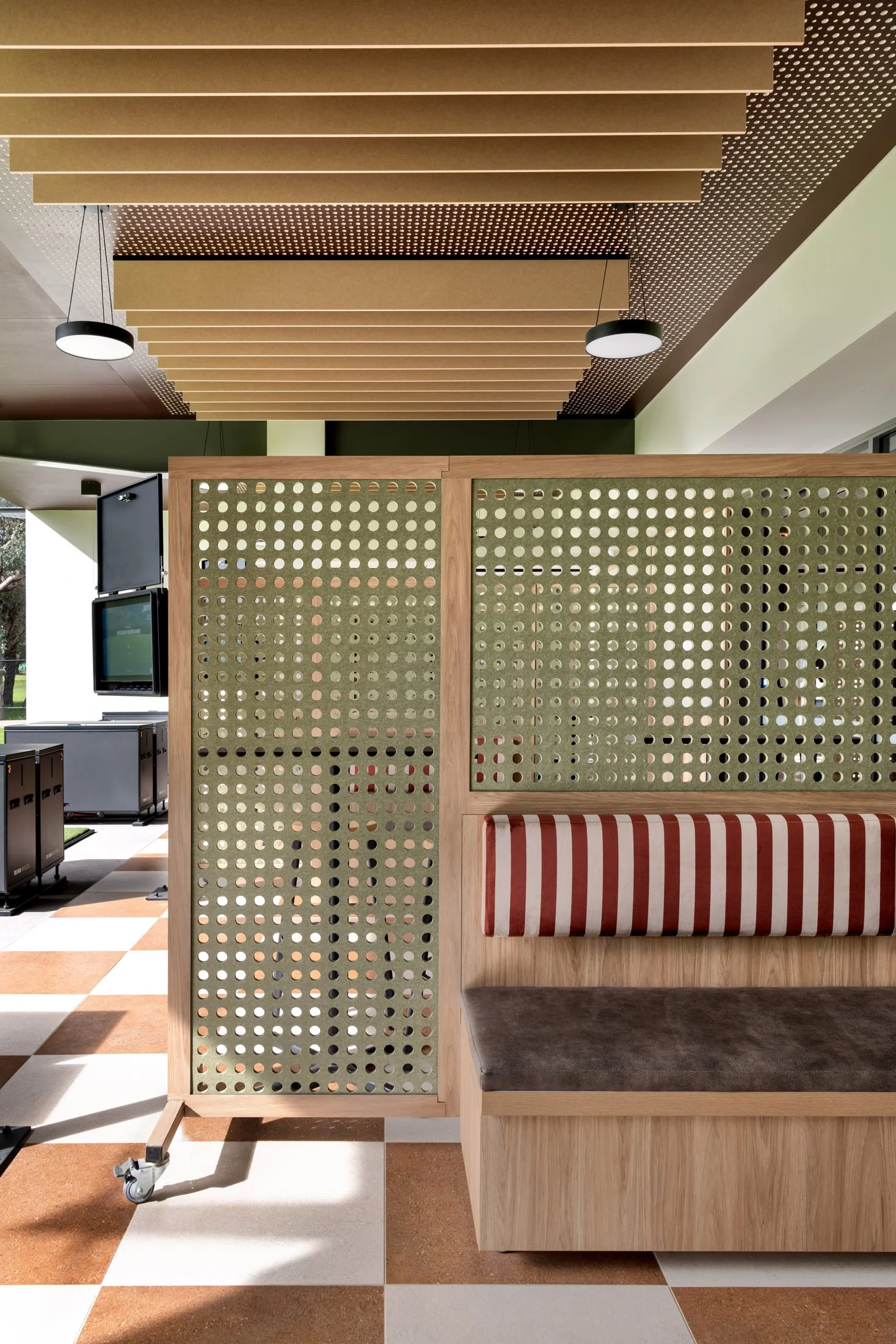 Custom screening and banquette seating at Whaleback Golf Course entertainment bays