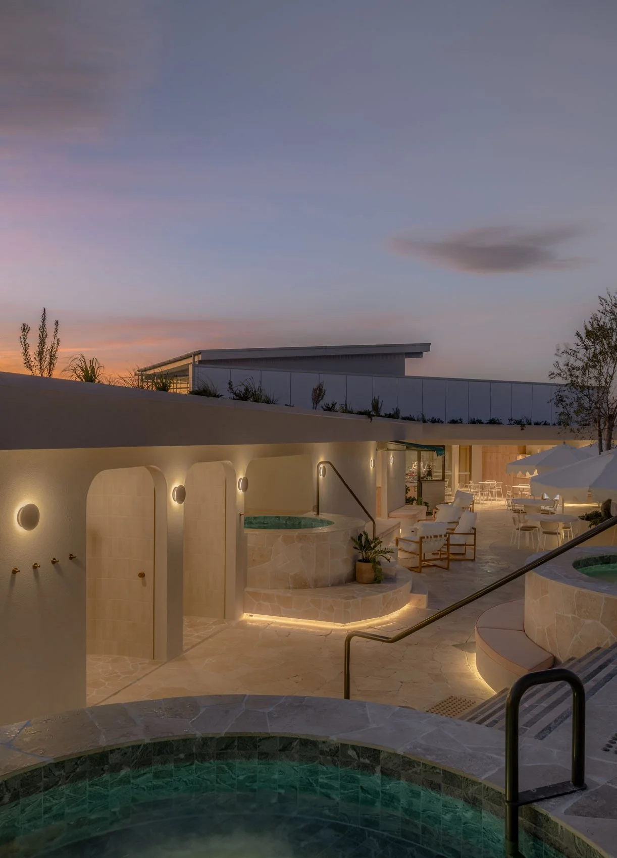 Rooftop wellness retreat with hot and cold plunge pools and daybeds