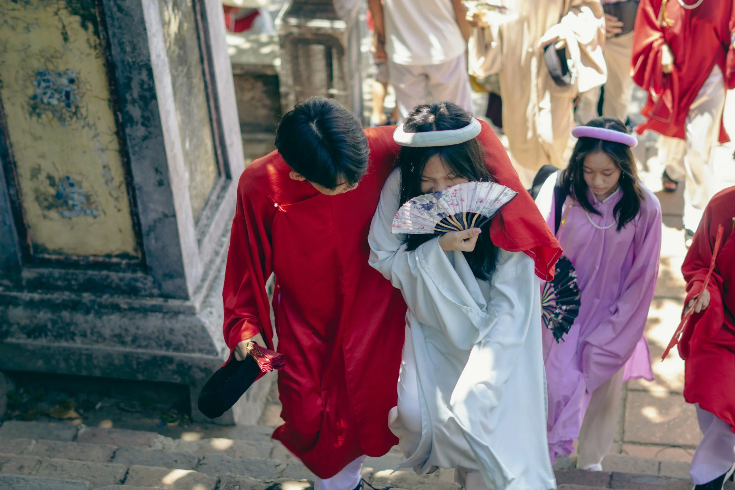 People dressed in traditional Chinese attire during a cultural event.