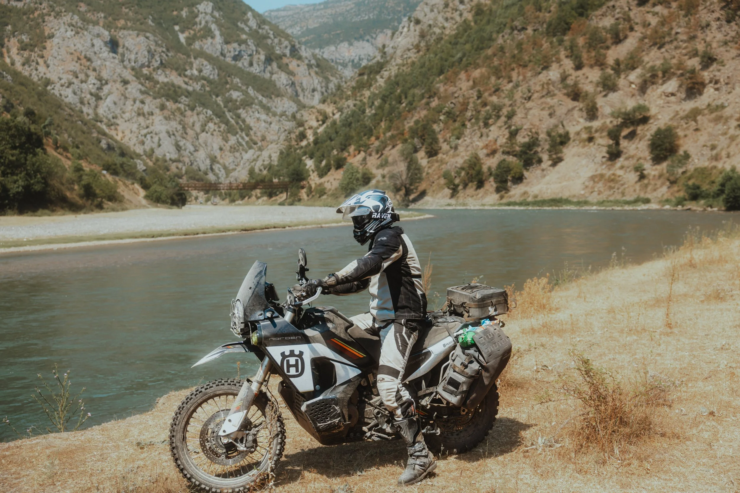 Cardo Packtalk Edge mounted on adventure motorcycle helmet