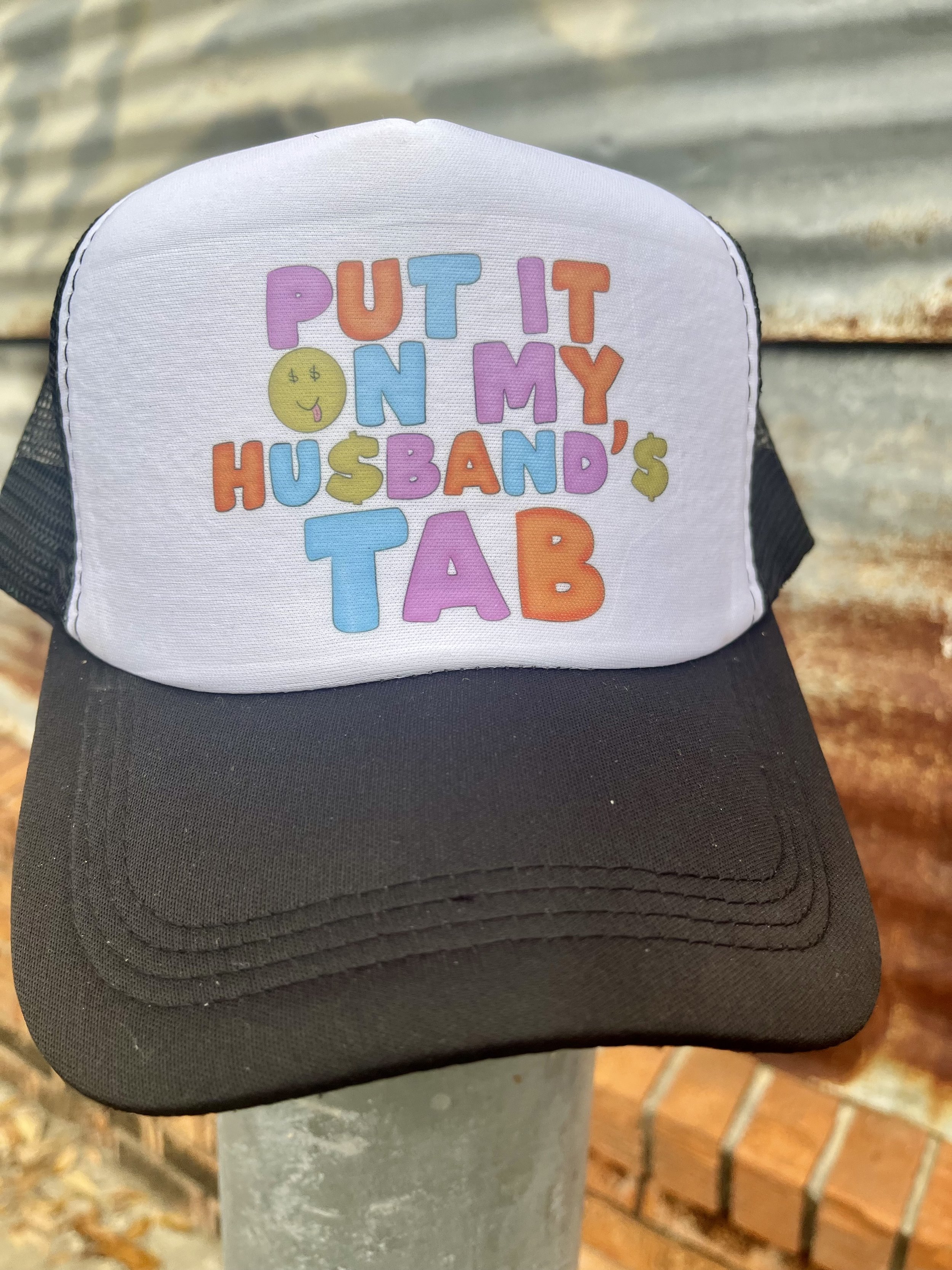 Put it on my husband’s tab trucker hat