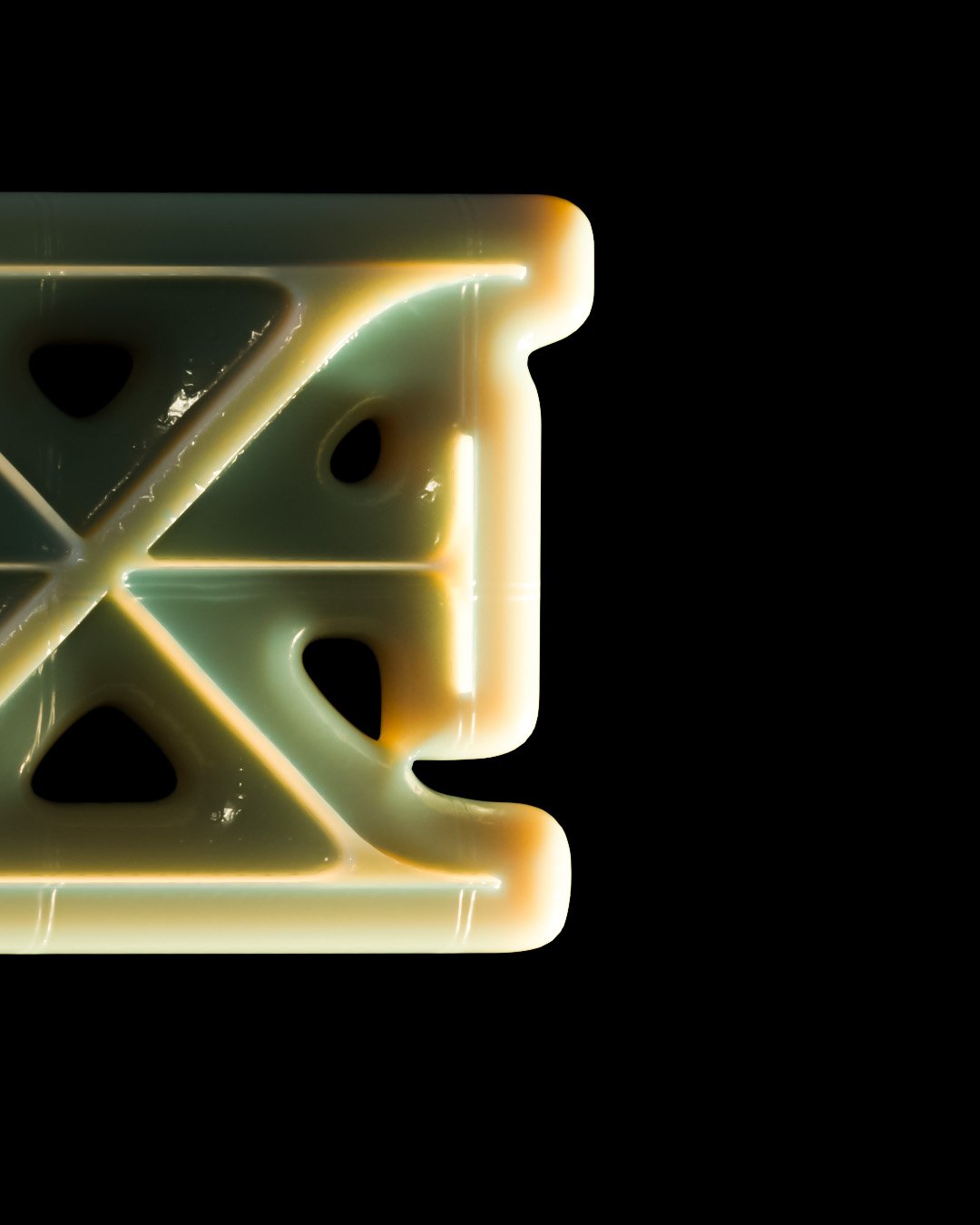 Close-up of a glowing plastic object with rounded edges, triangular cutouts, and a faint green hue on a black background.