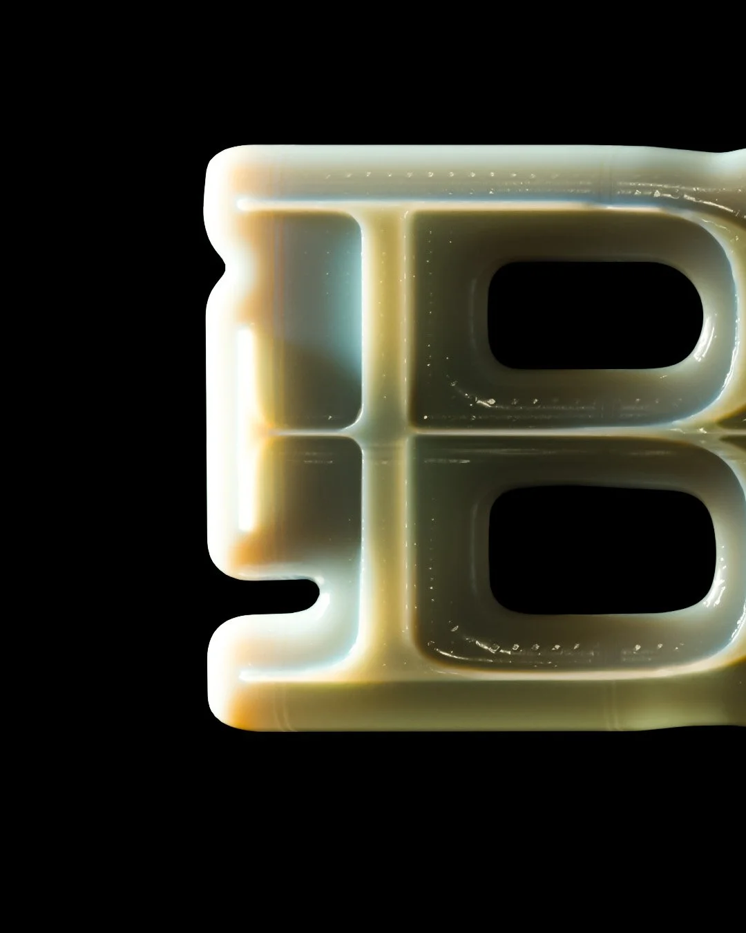 Close-up of a letter 'B' shaped pasta on a black background.