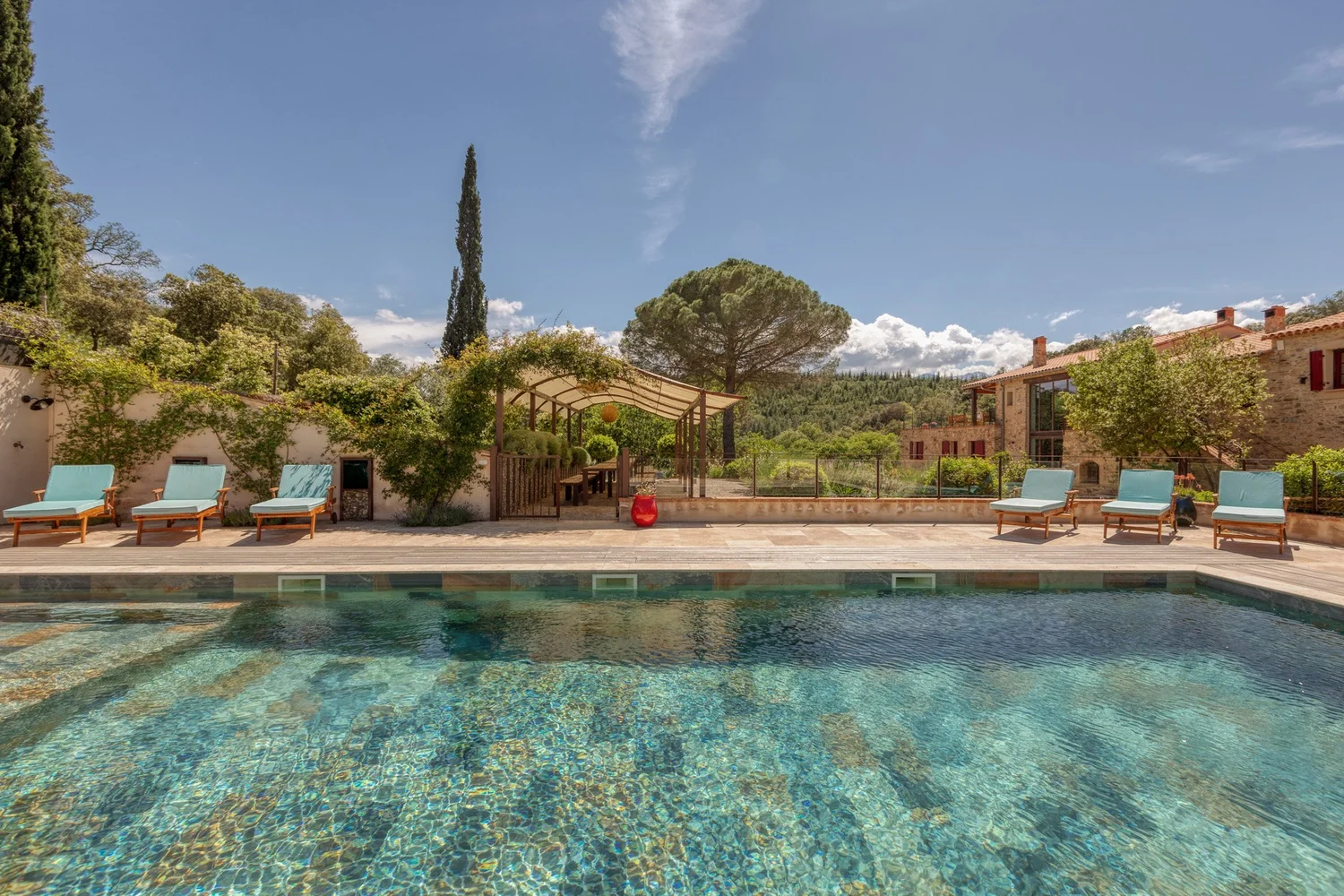 Domaine Madrona farmhouse and pool in the wooded hills of Castelnou