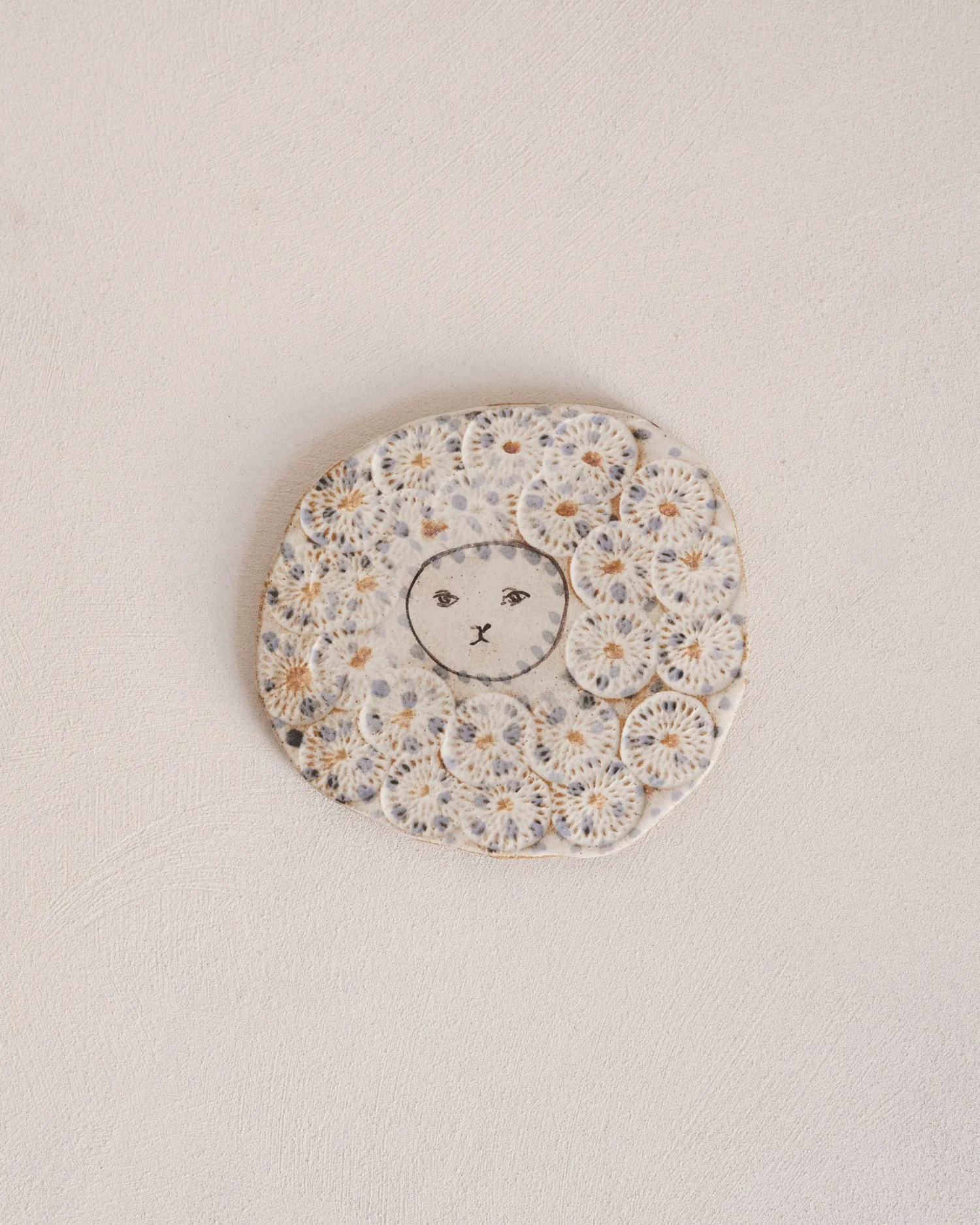 Embossed Face Tiles by Charlotte Salt, 2026