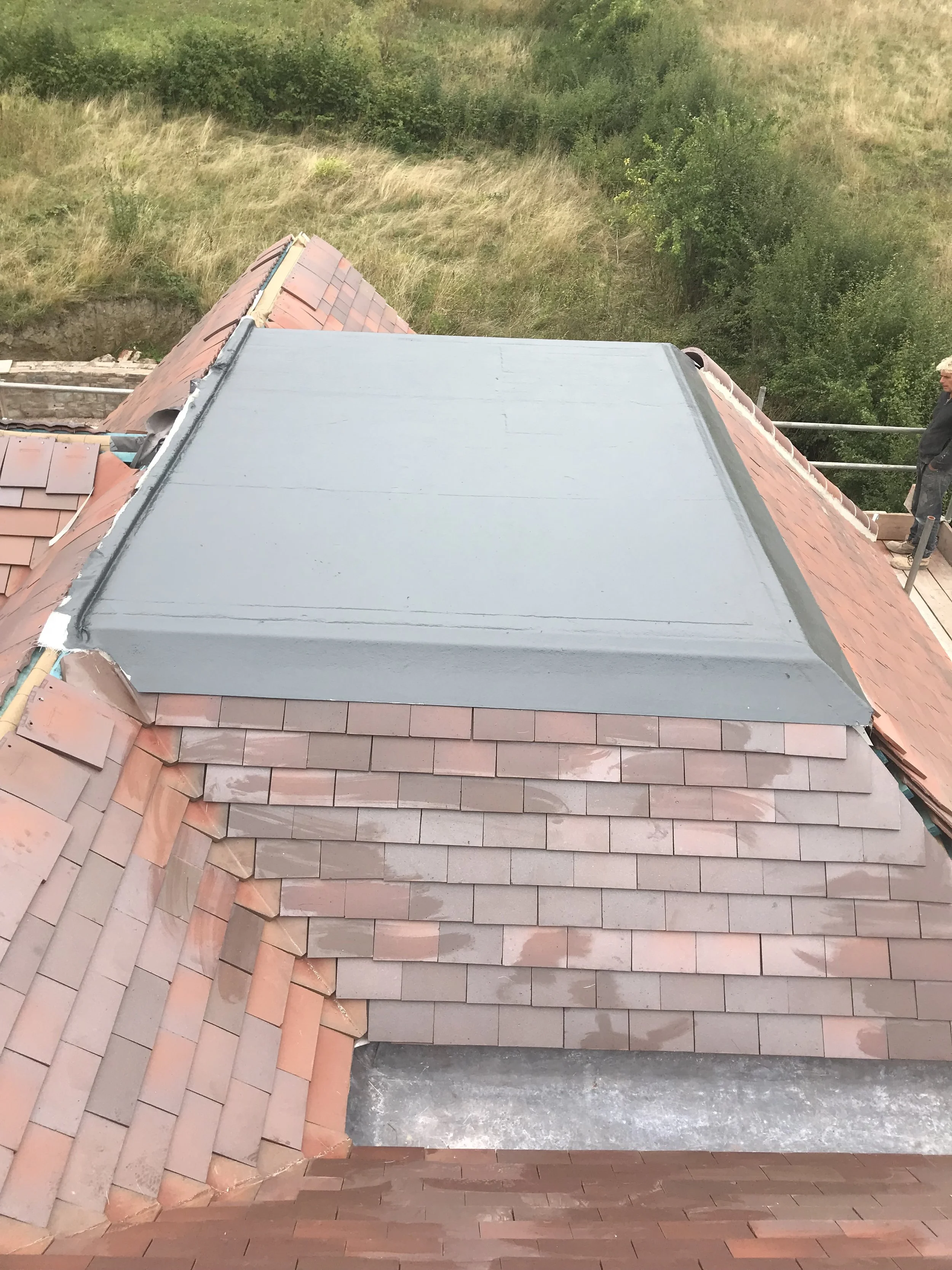 The outer coverings: bricks, timber cladding, roof tiling &amp; flat roof sealing