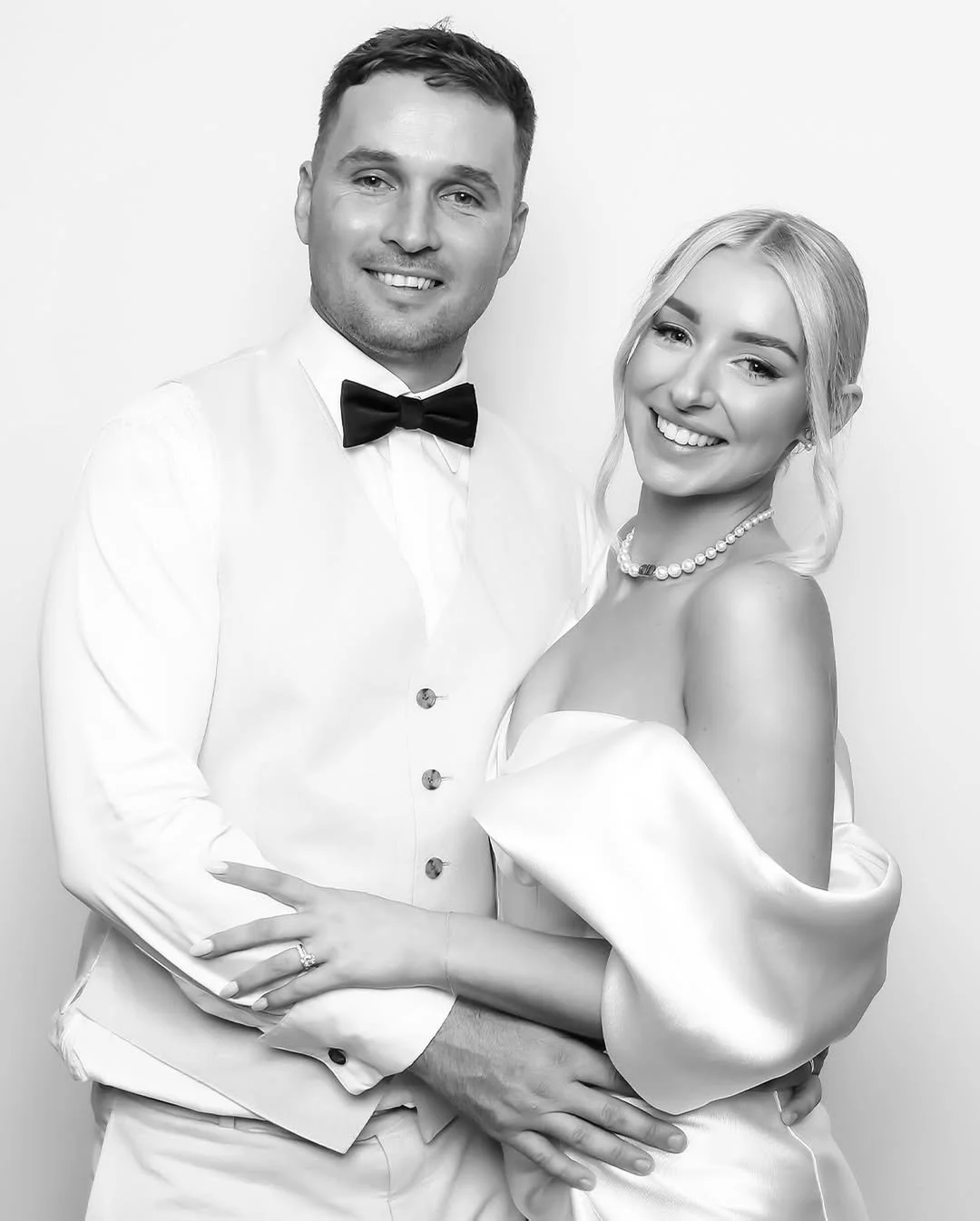 Guests enjoying a memorable moment at a photo booth rental in Atlanta, complete with props and backdrops