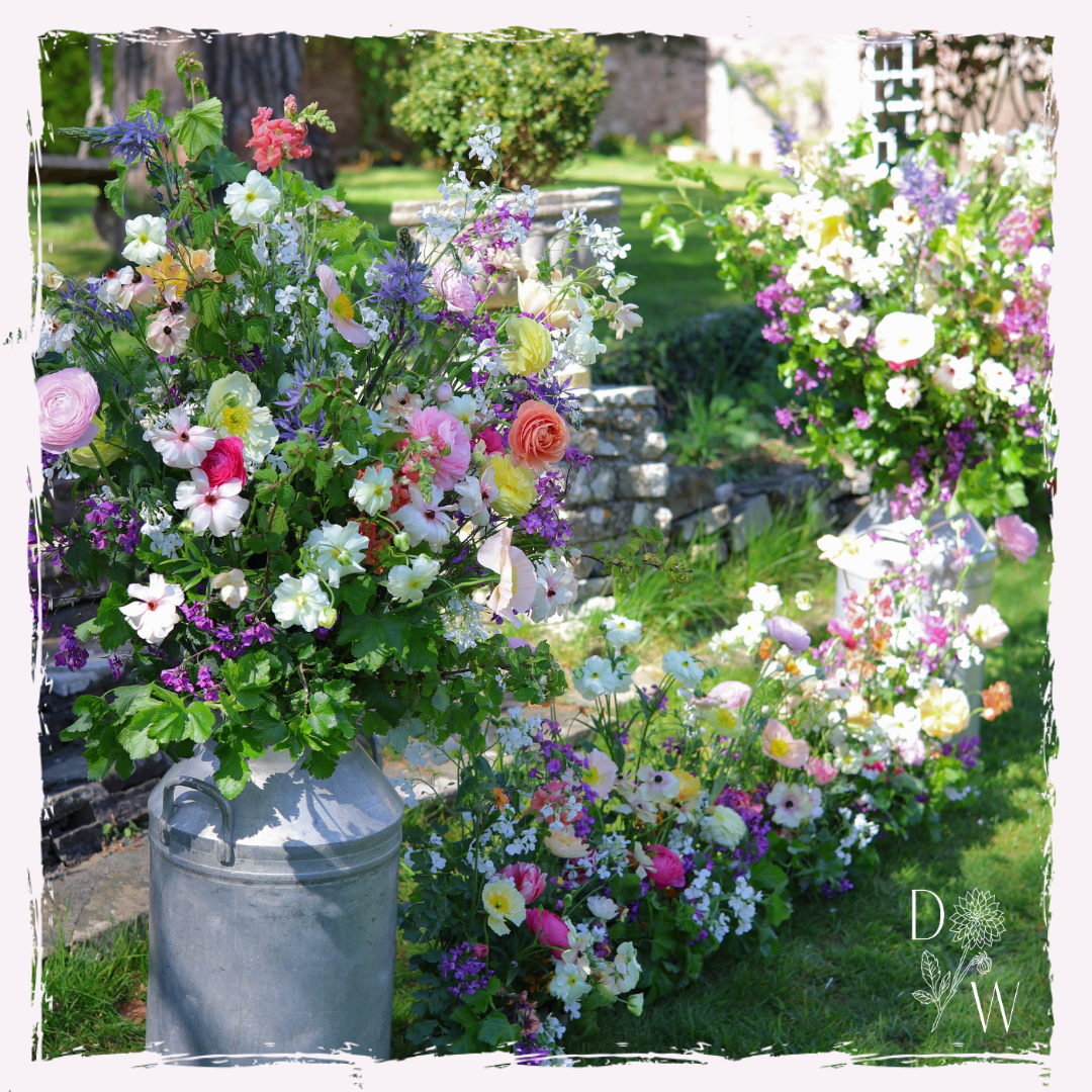 April wedding milk churn arrangement