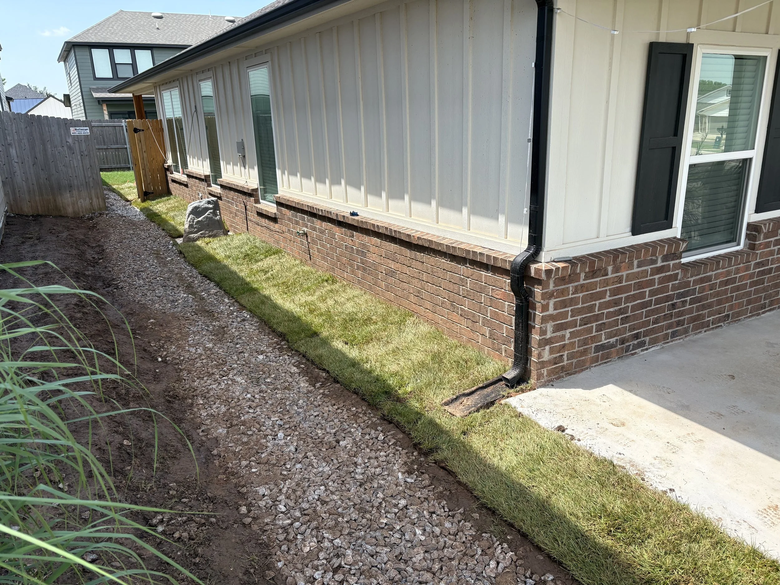 french-drain-rock-bed-install-with-fescue-sod