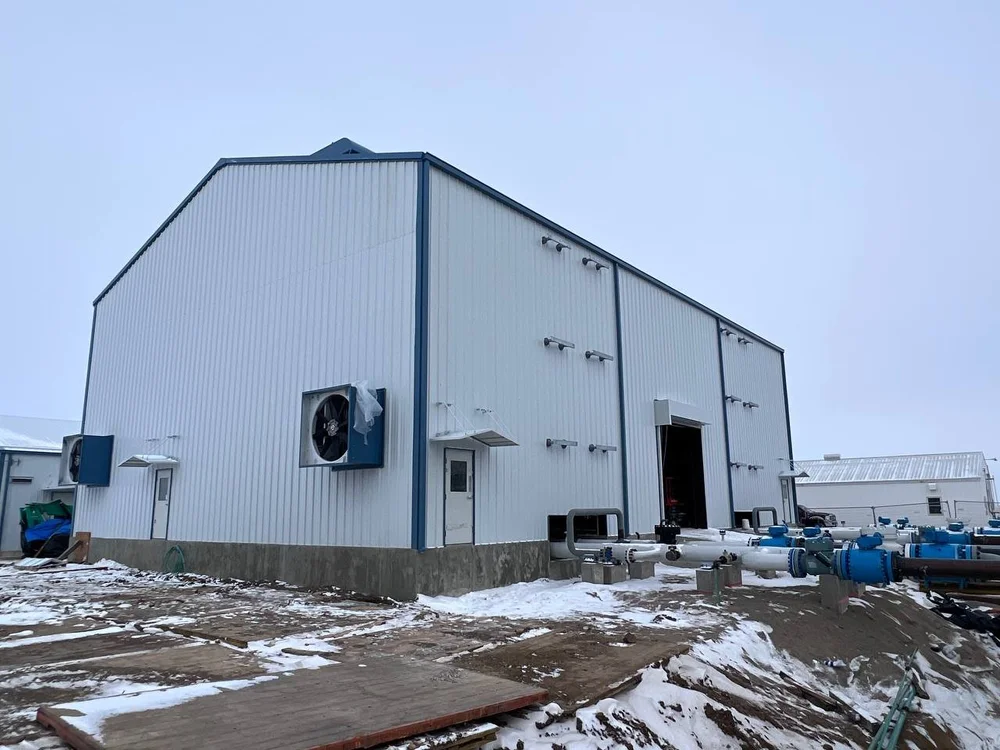 Tall white metal building