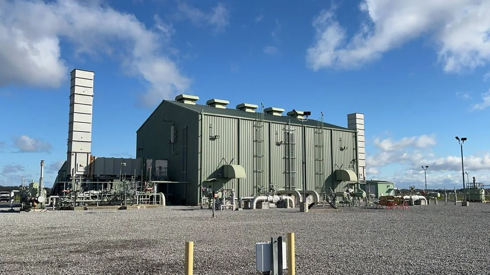 Steel equipment building with exhaust stacks