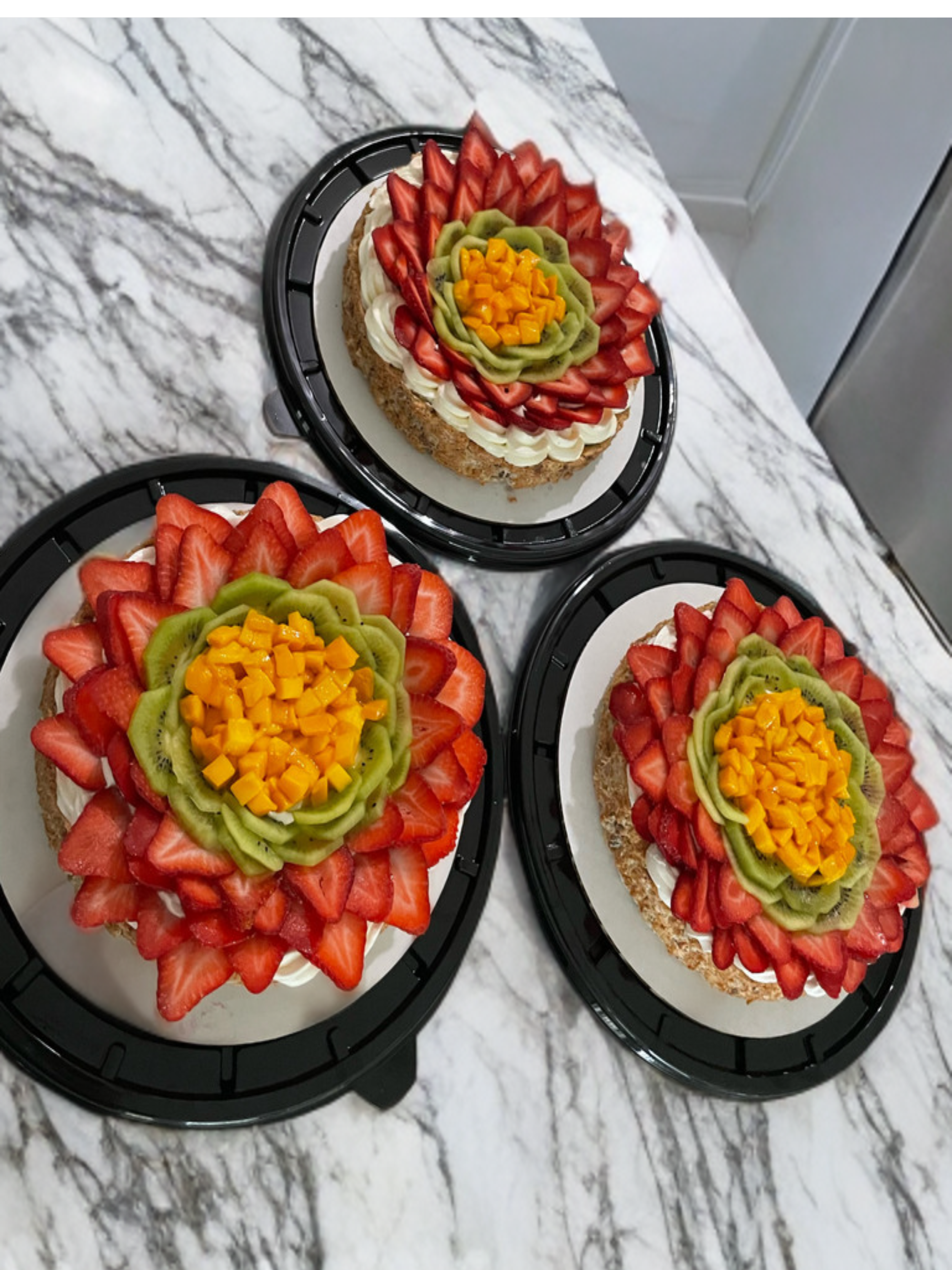 Cheesecake mostachon in Brownsville Texas with strawberries mango and kiwi