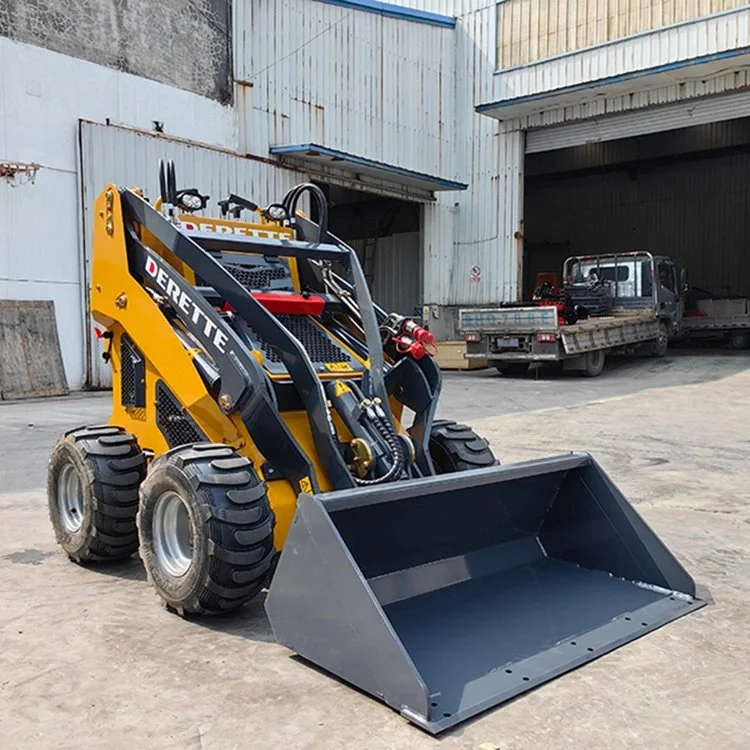 Yellow skid steer loader parked in front of a warehouse with a bucket attachment in foreground, showcasing an industrial setting.