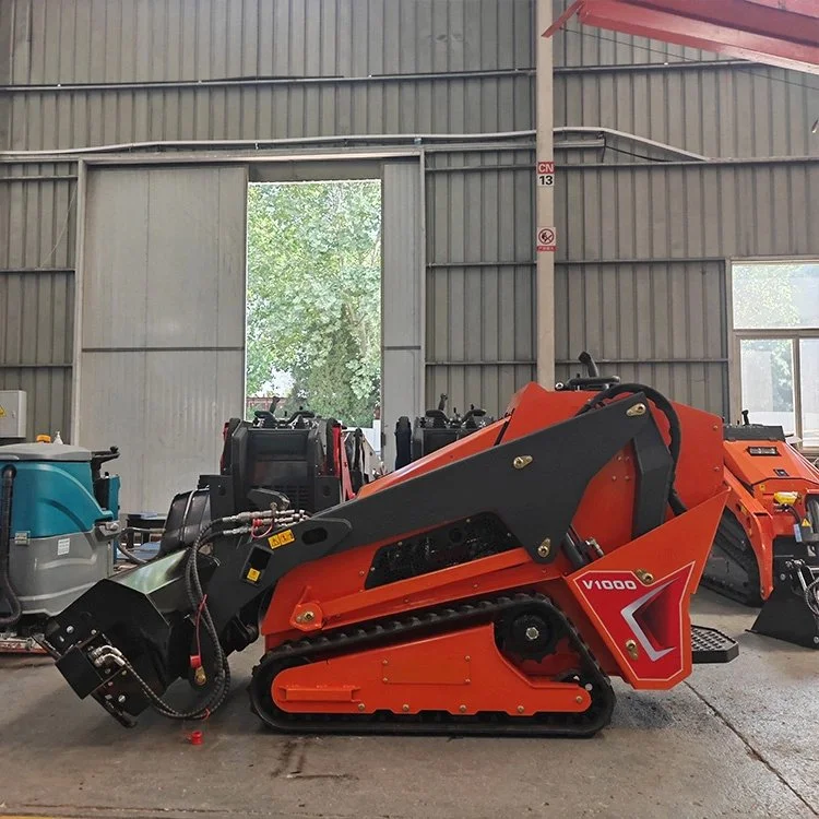 Industrial mini skid steer loader parked indoors